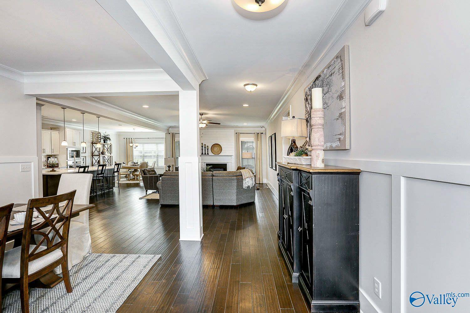 Open-concept living area with hardwood floors in The Finleigh floor plan by Davidson Homes in Briercreek, Meridianville.