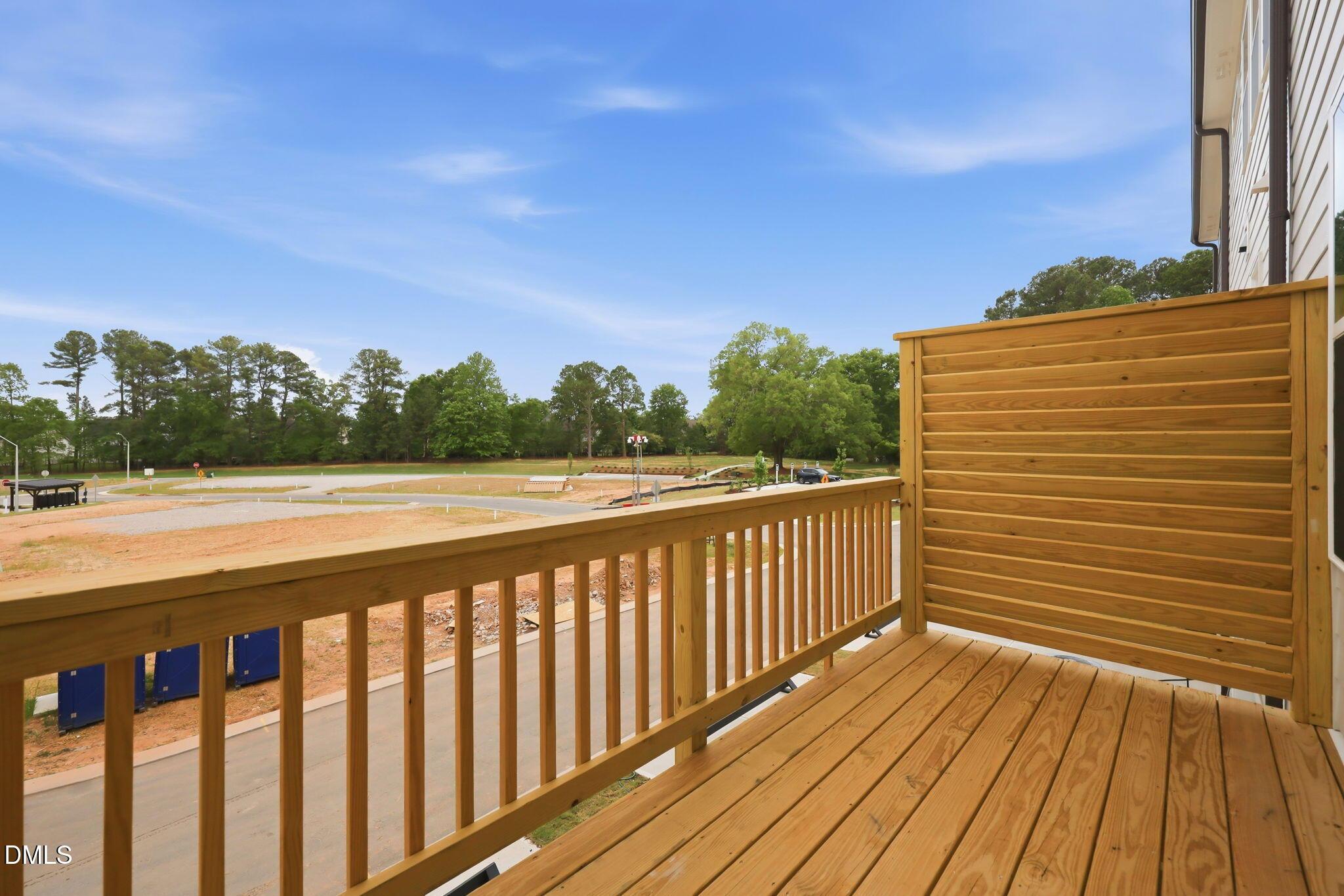 Wooden balcony deck overlooking the neighborhood construction at Camden Park in Knightdale, North Carolina.