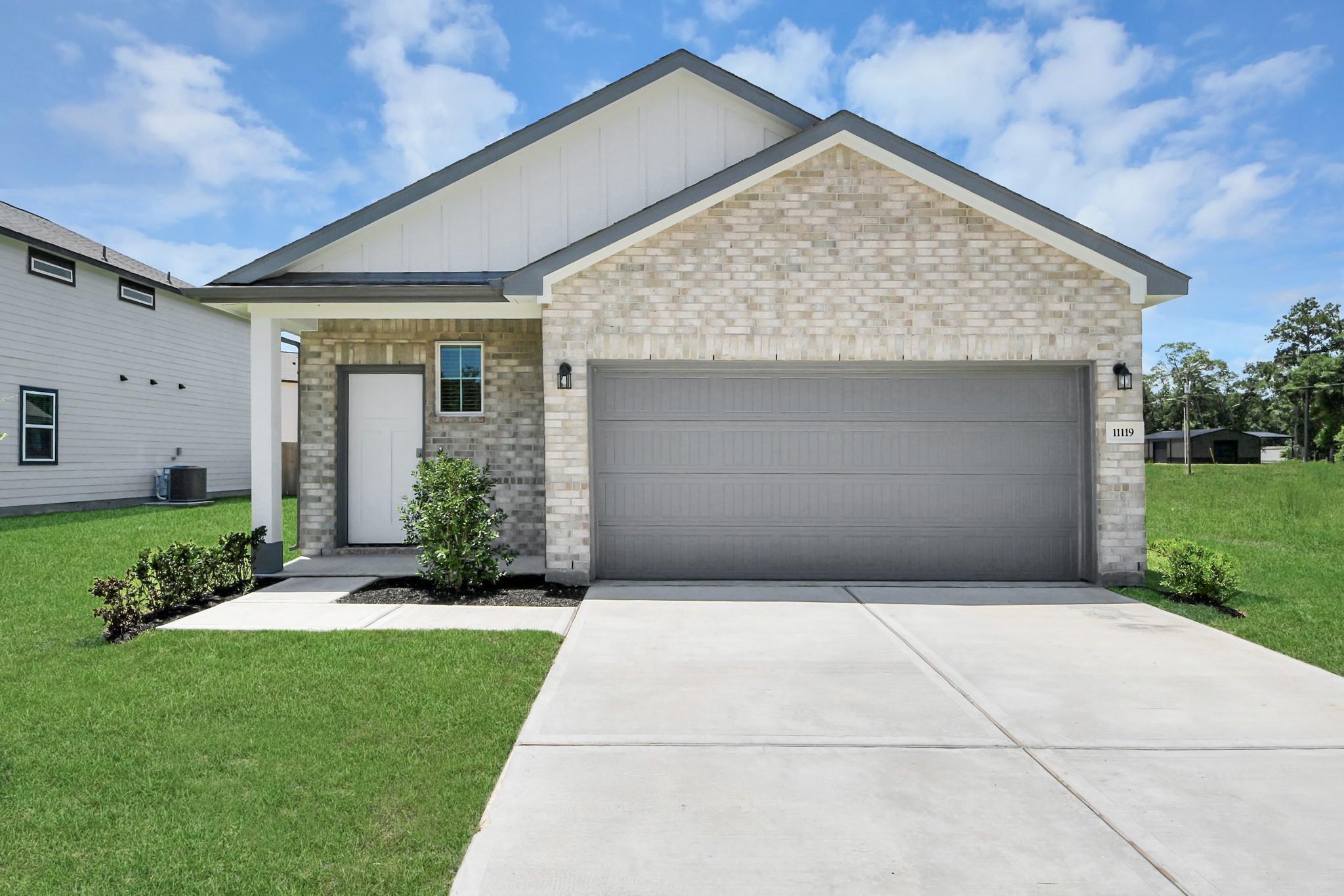 The Frio F floor plan one-story home with 2-car garage in Liberty Estates, Cleveland, Texas.