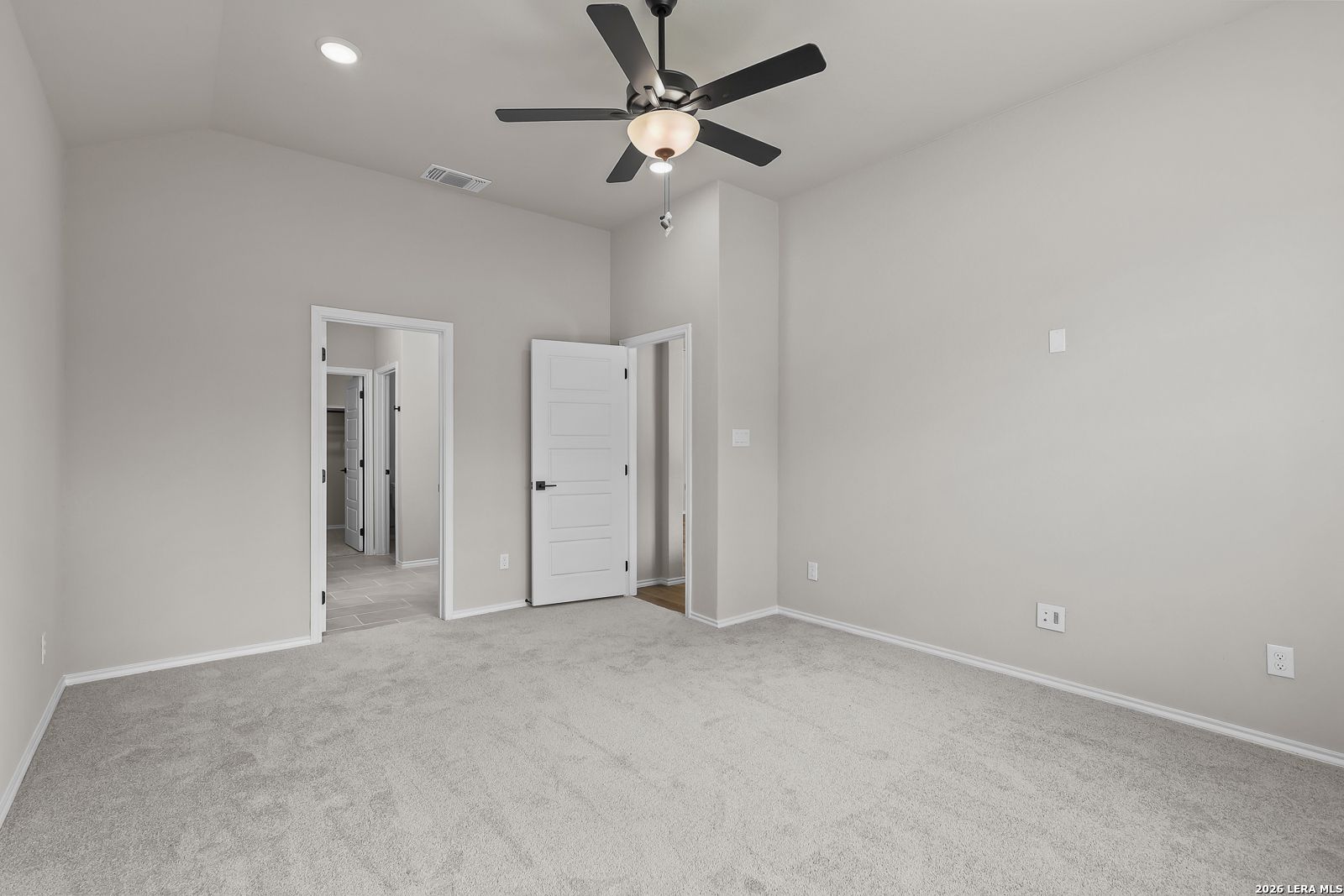 Spacious bedroom with ceiling fan and plush carpet in Davidson Homes The Sequoia C, Royal Crest, San Antonio, Texas