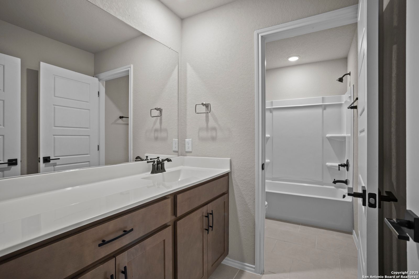 Spacious double vanity bathroom with soaking tub, walk-in shower in Davidson Homes The Douglas F, San Antonio, Texas