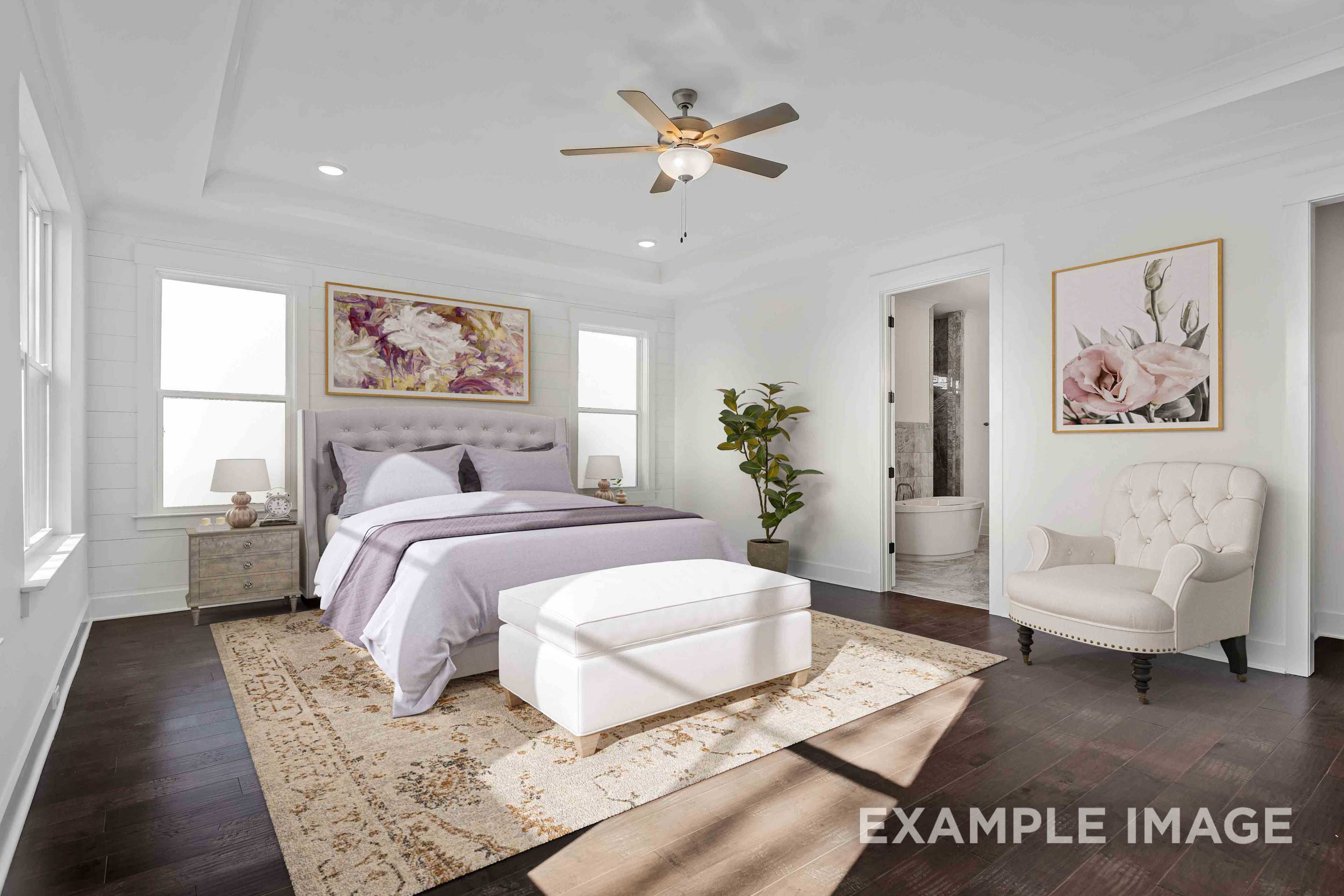 Spacious master bedroom in Shelton Square Murfreesboro TN with purple bedding, hardwood floors, ceiling fan and floral wall art