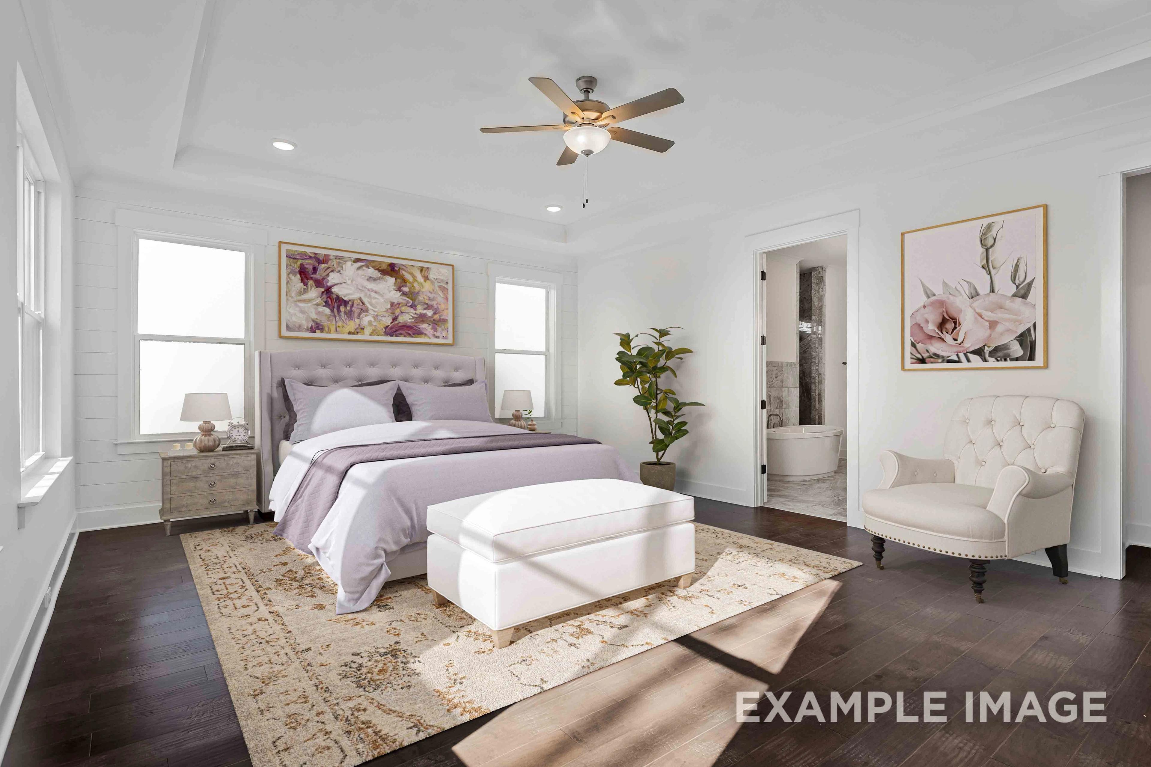 Spacious master bedroom in Shelton Square Murfreesboro TN with purple bedding, hardwood floors, ceiling fan and floral wall art