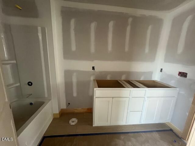 Bathroom under construction with white dual vanity and tub-shower combo in The Gavin C plan, Gregory Village, Lillington.