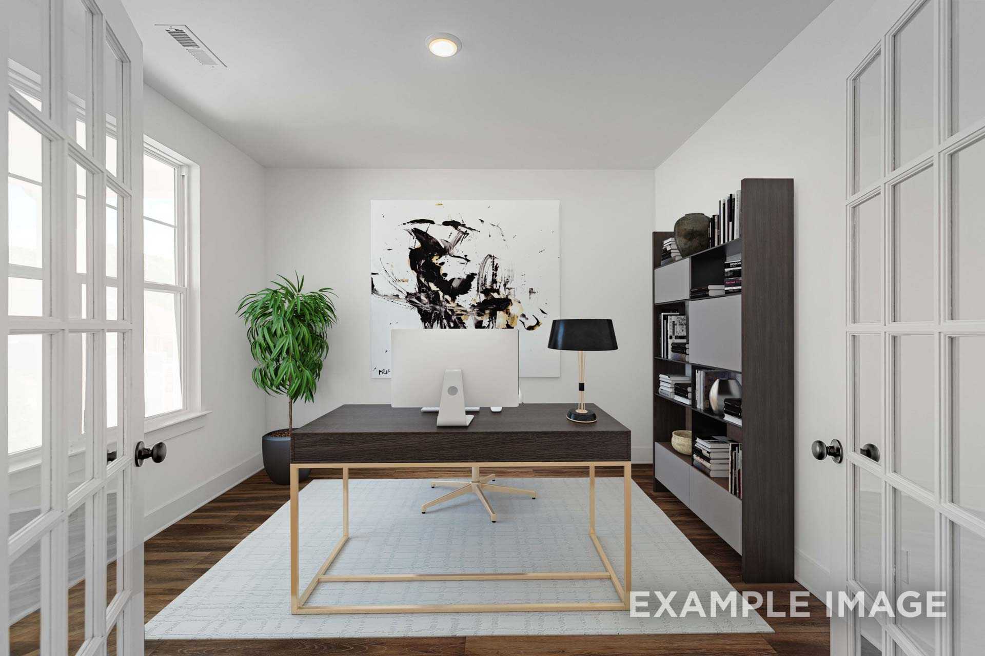 Modern home office in The Ash C with dark wood desk, iMac, abstract art, bookshelves, and potted plant