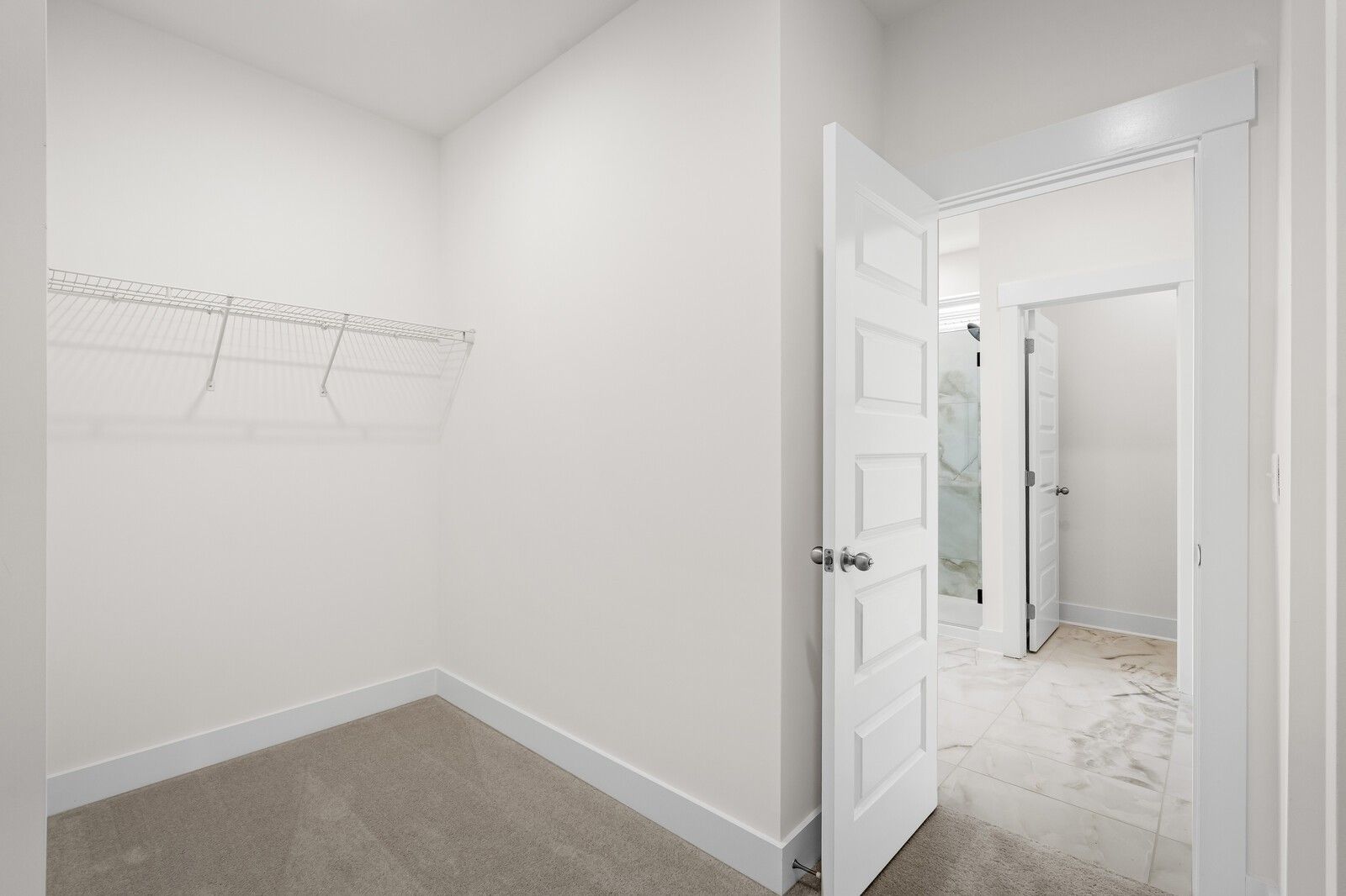 Walk-in closet connected to master bathroom in The Prairie C floor plan at Woods Crossing, Gallatin, Tennessee.