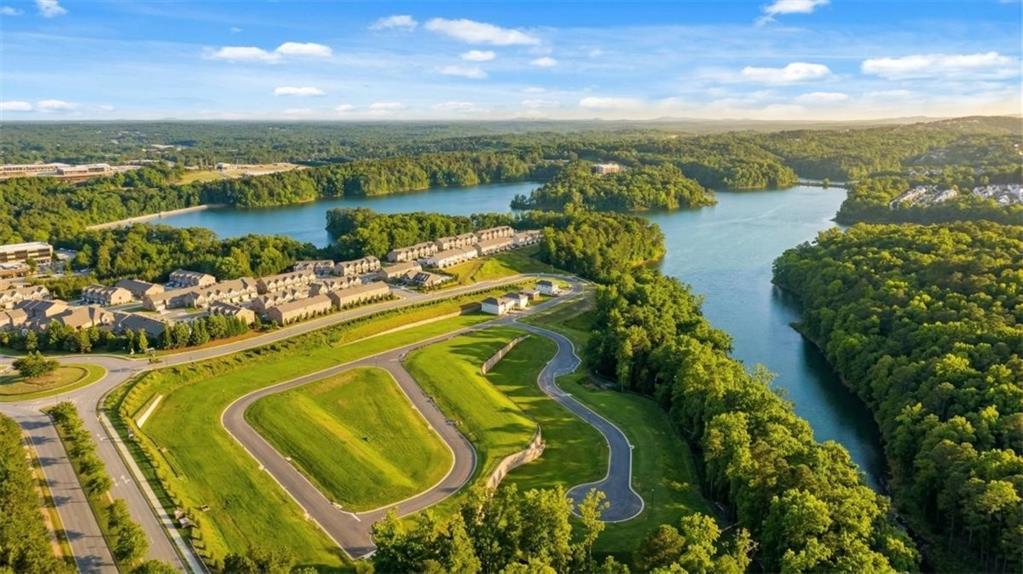 Aerial view of The Bluffs community in Canton, Georgia, featuring new home sites near scenic lakefront woodlands.