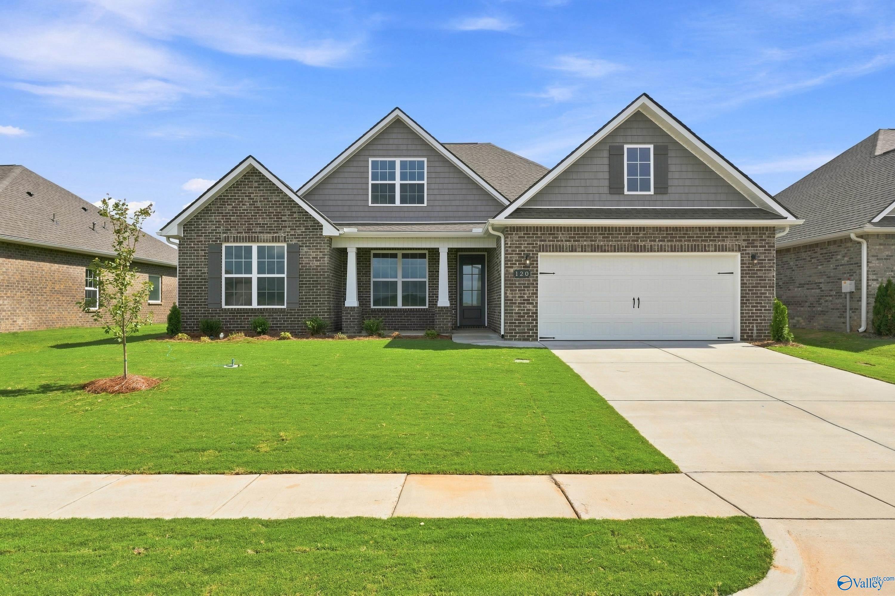 The Rockford B floor plan by Davidson Homes featuring brick exterior and 2-car garage in Kendall Downs, Toney, Alabama.