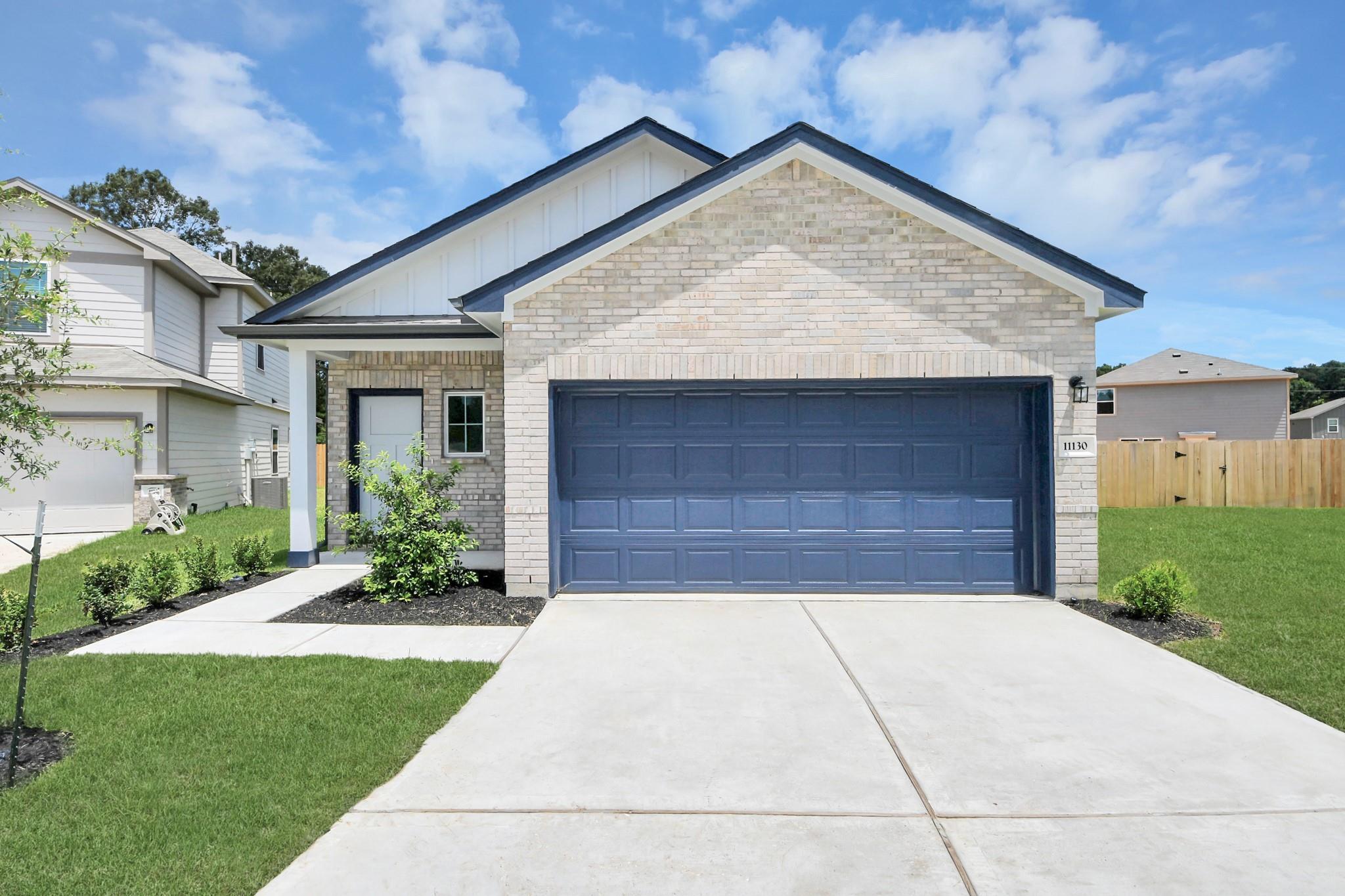 The Sabine F floor plan by Davidson Homes in Liberty Estates, Cleveland, Texas featuring a 2-car garage and brick exterior.