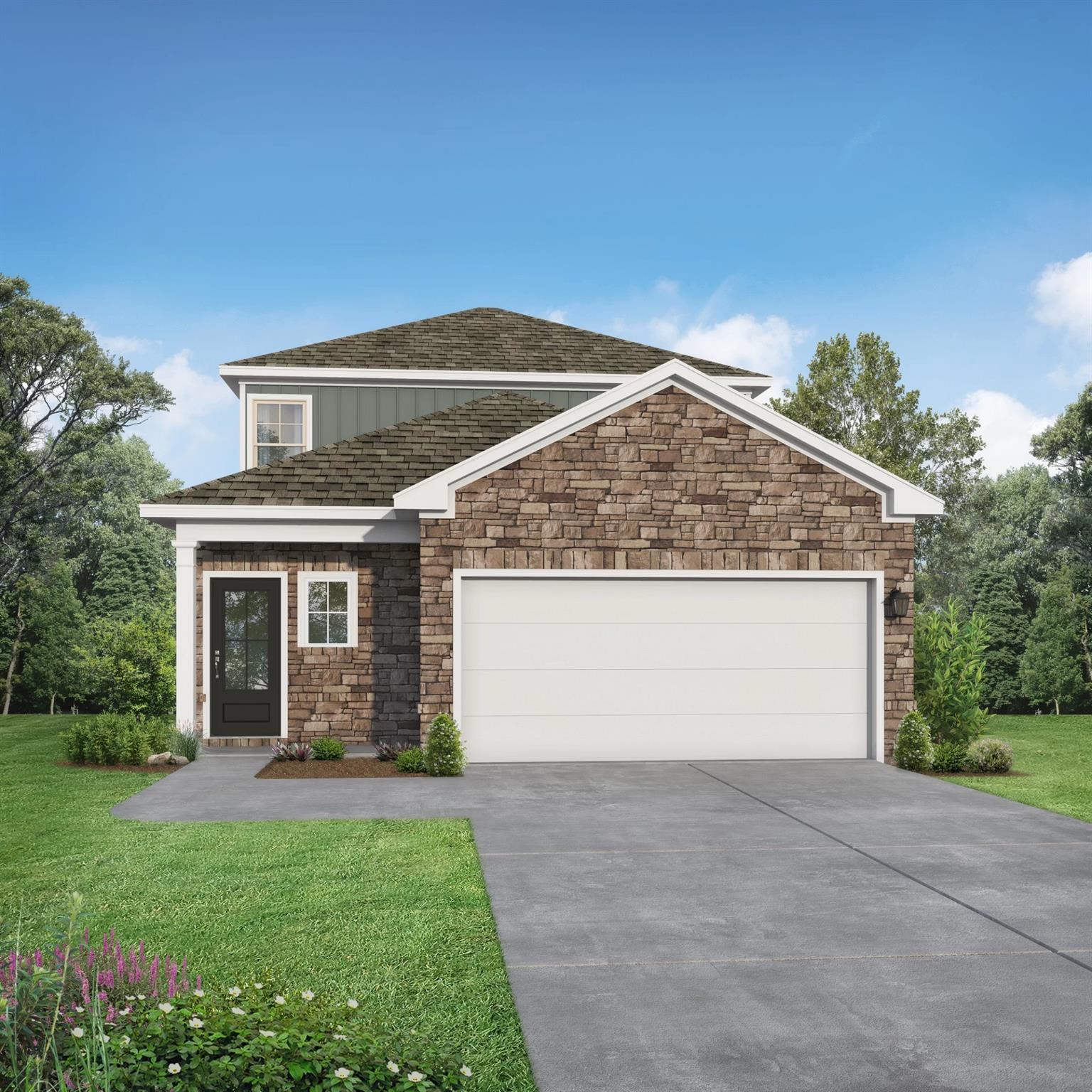 Two-story Sabine E home with stone facade, 2-car garage, and lush front yard landscaping in Liberty Estates, Cleveland, Texas