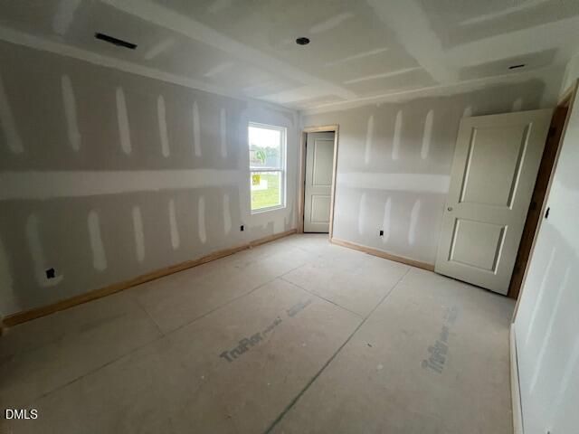 Unfinished bedroom with drywall and subfloor in The Hickory II C floor plan at Retreat at North Main in Lillington, NC.