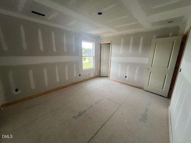 Unfinished bedroom with drywall and subfloor in The Hickory II C floor plan at Retreat at North Main in Lillington, NC.