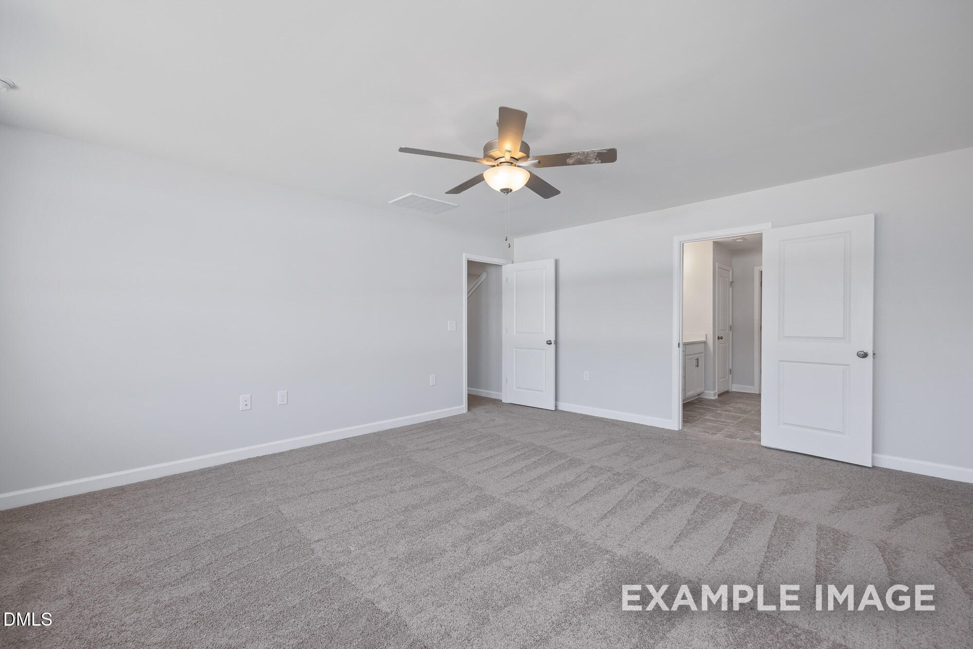 Spacious master bedroom with ceiling fan, en-suite bath, and walk-in closet in Davidson Homes The Hickory II B, Lillington, NC