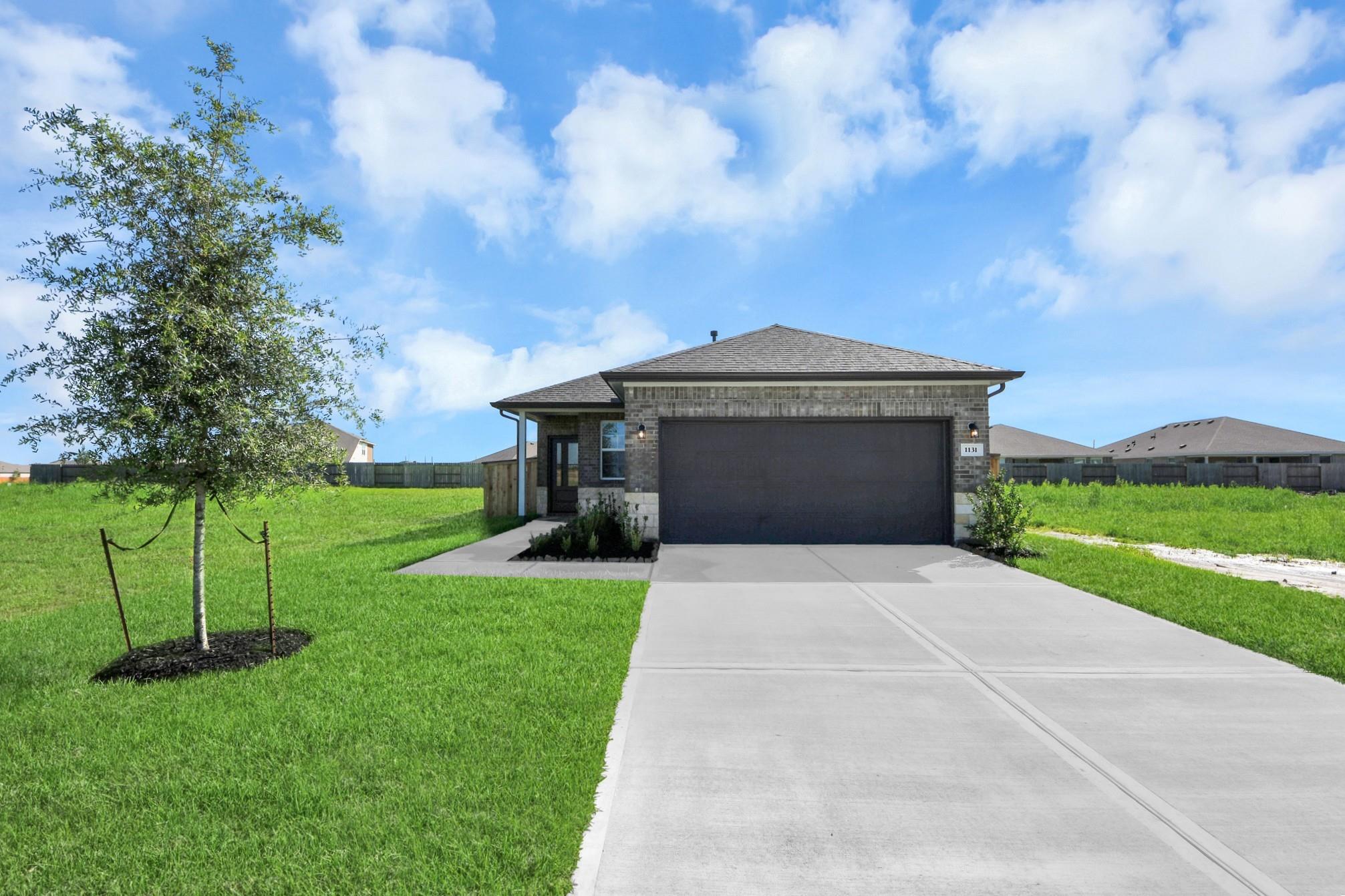 Single-story 4-bedroom home in Emberly, Beasley, Texas with a 2-car garage, featuring the Davidson Homes Colorado G plan.