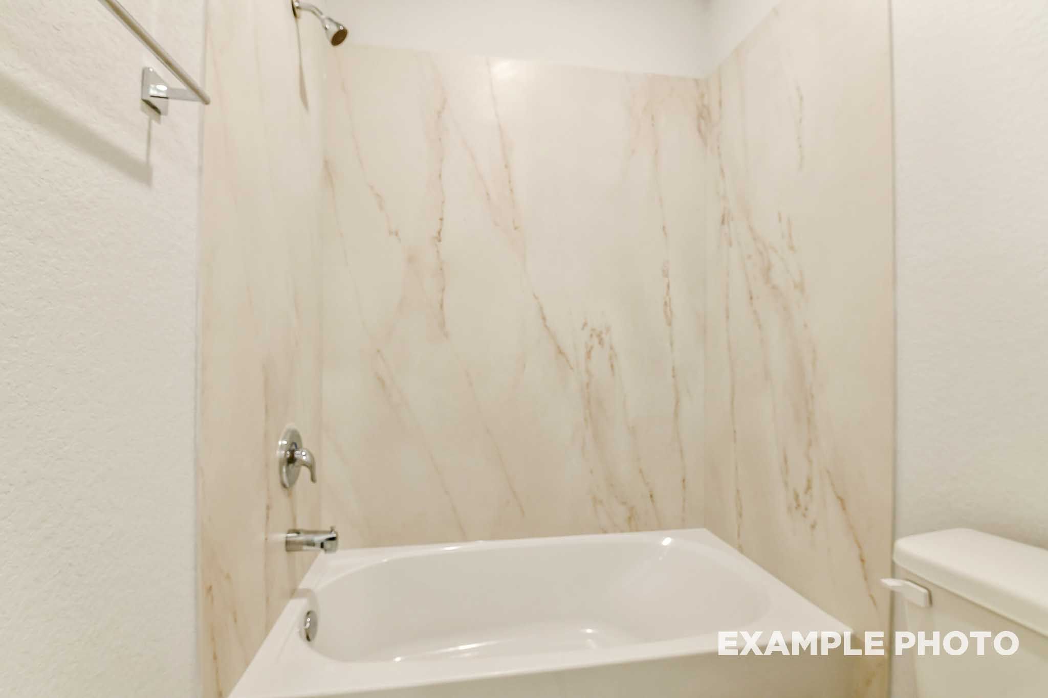 Marble surround garden tub in the master bath of The Colorado, a Davidson Homes single-family design in Beasley, Texas