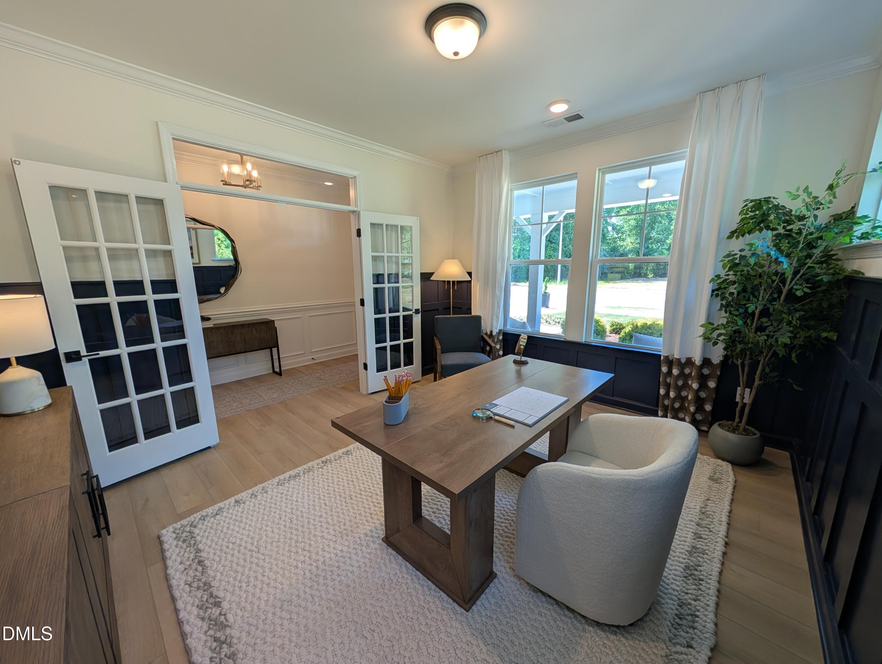 Modern home office with French doors in The Aspen B floor plan at Wendell Ridge in Wendell, North Carolina.