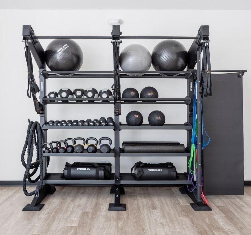 Equipped home gym with weight racks, dumbbells, kettlebells, stability balls in The Alston A by Davidson Homes, Shelton Square, Murfreesboro