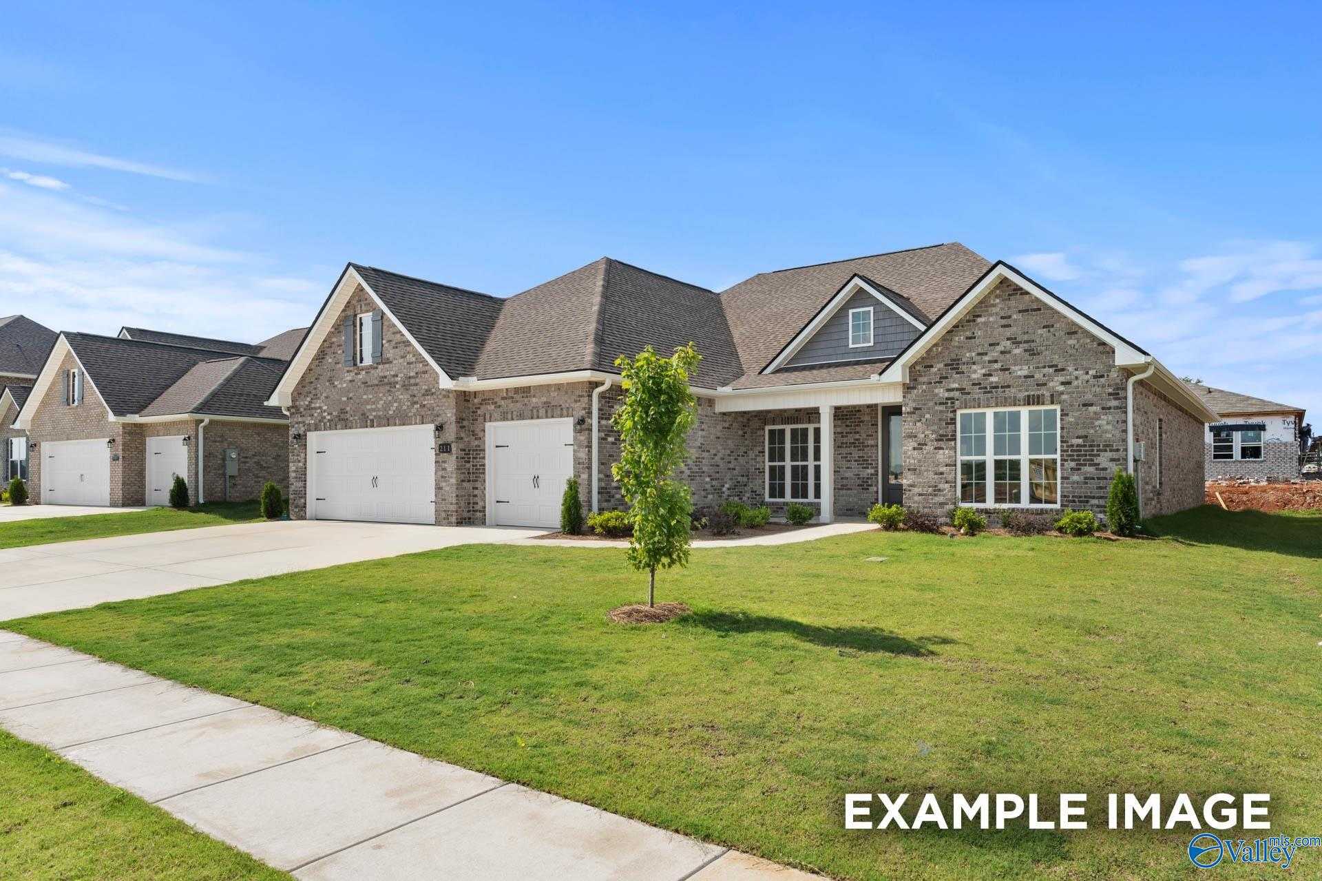 Charming brick single-story home with 2-car garage, driveway, and lush lawn in Briercreek, Meridianville, Alabama - Davidson Homes The Finleigh