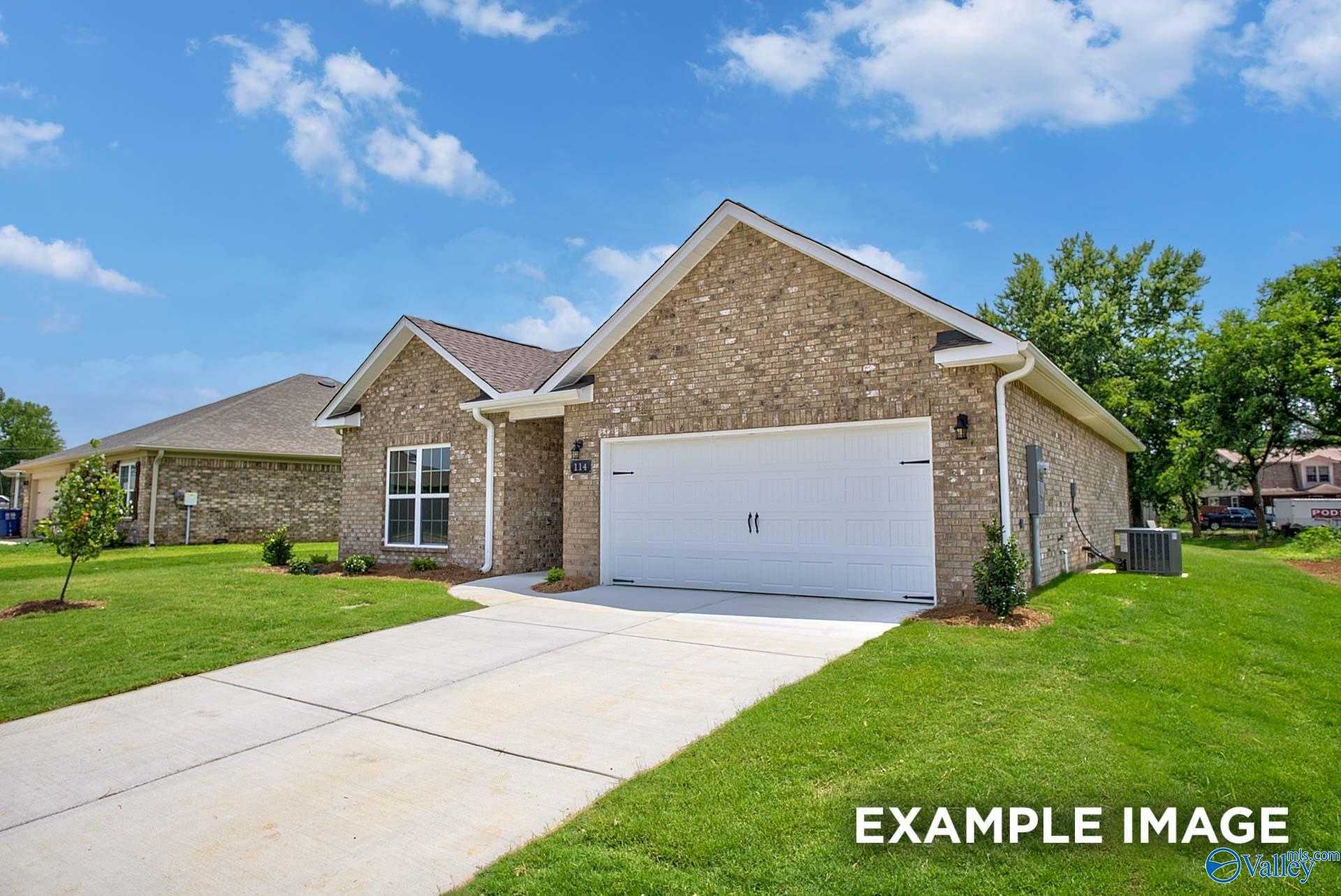 Single-story brick ranch home with 2-car garage, driveway, and landscaped yard in Walker's Hill, Meridianville, Alabama - The Asheville C by Davidson Homes