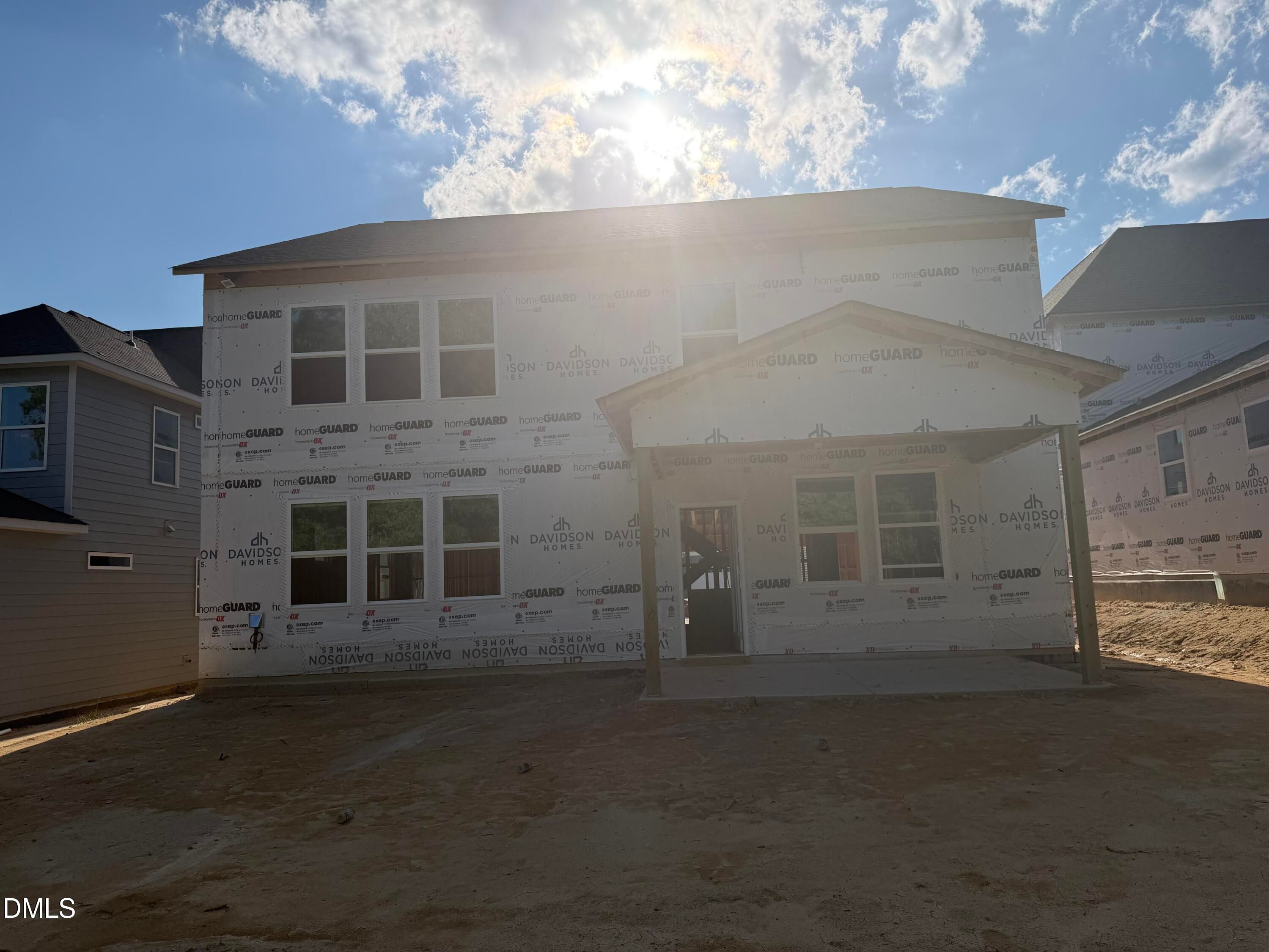 Two-story Davidson Homes new construction under way with covered patio in Wendell Ridge, Wendell, North Carolina.