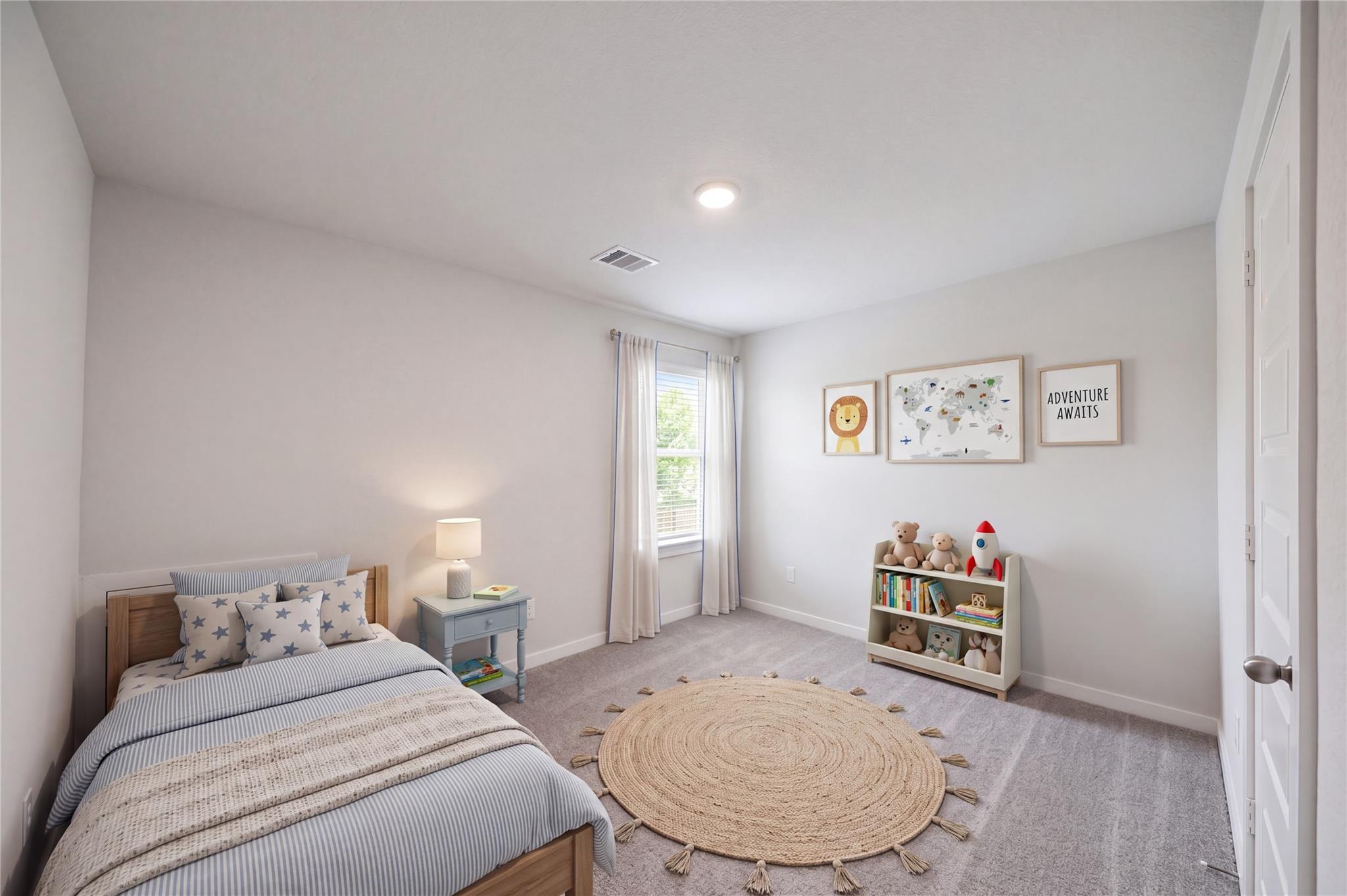 Bright bedroom with twin bed, round jute rug, and toy shelf in Davidson Homes The Brazos F, Liberty Estates, Cleveland, Texas