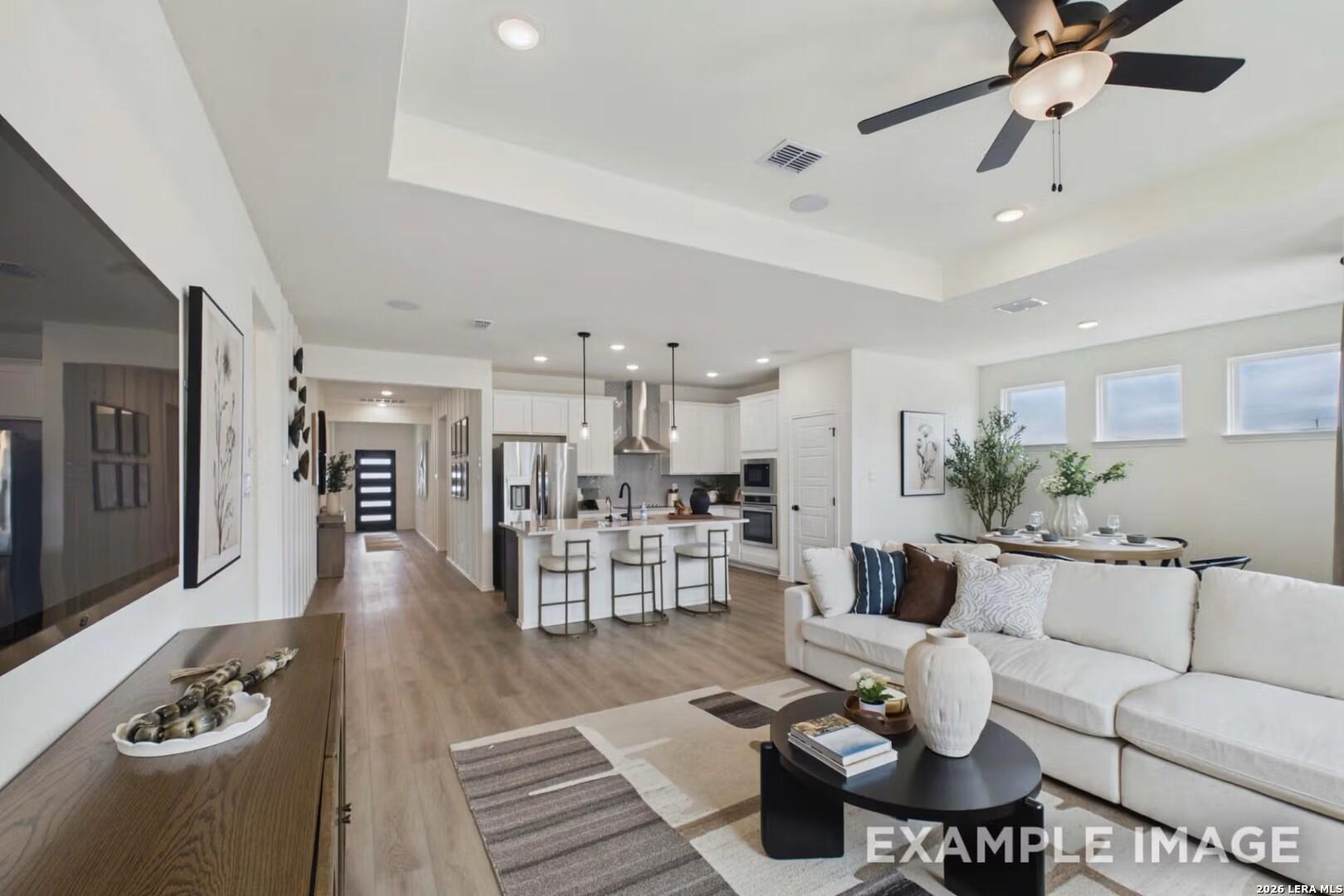 Open-concept living room and kitchen in The Laurel I floor plan by Davidson Homes in Rayburn Valley, San Antonio, Texas.