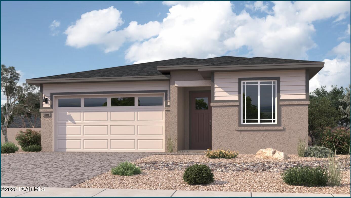 Modern single-story home with 2-car garage, beige siding, and desert rock landscaping in Prescott, Arizona - Davidson Homes The Frontier II F