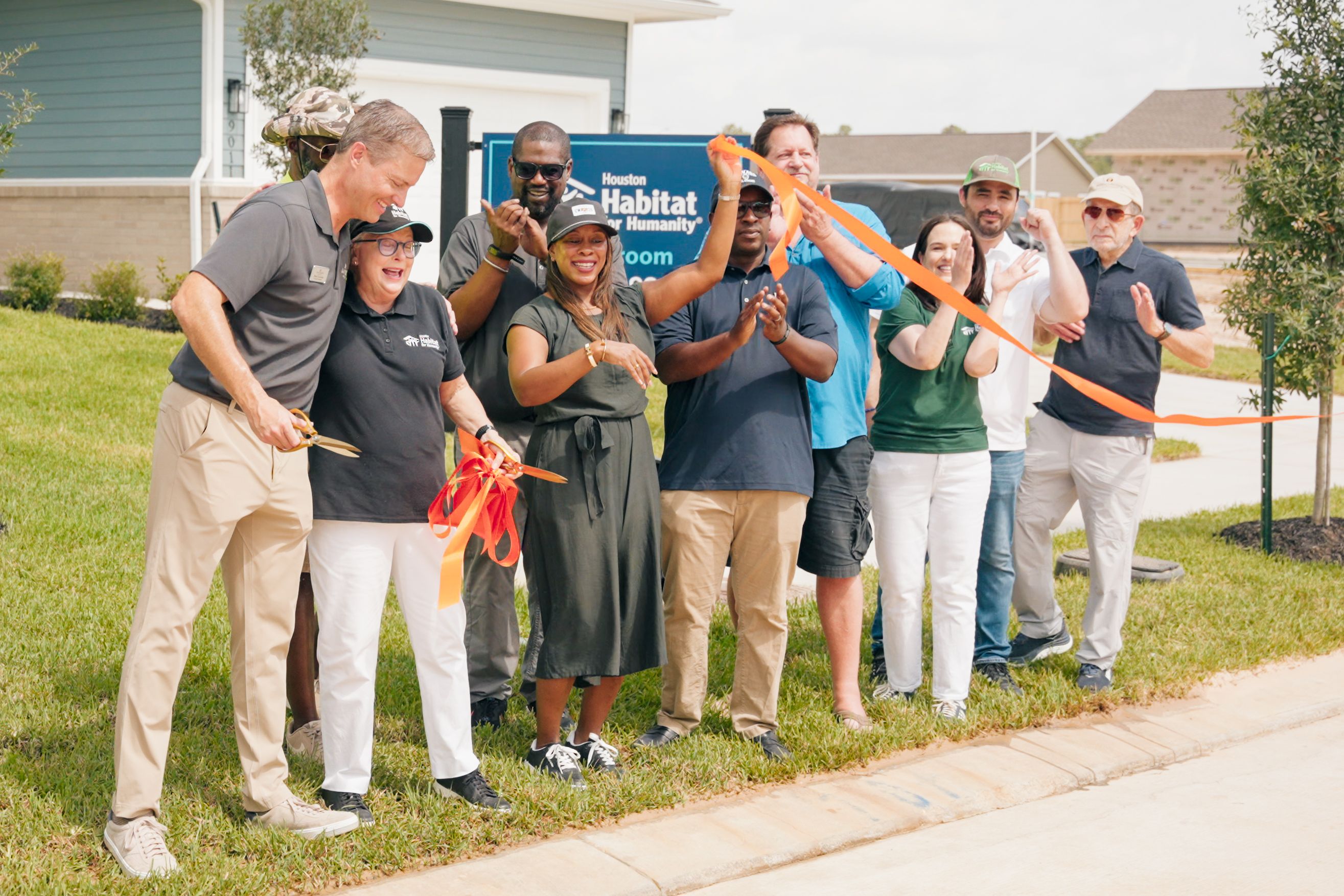 Davidson Homes and Houston Habitat for Humanity celebrate the grand opening and ribbon cutting for Section 2 at Robins Landing in Houston, Texas.