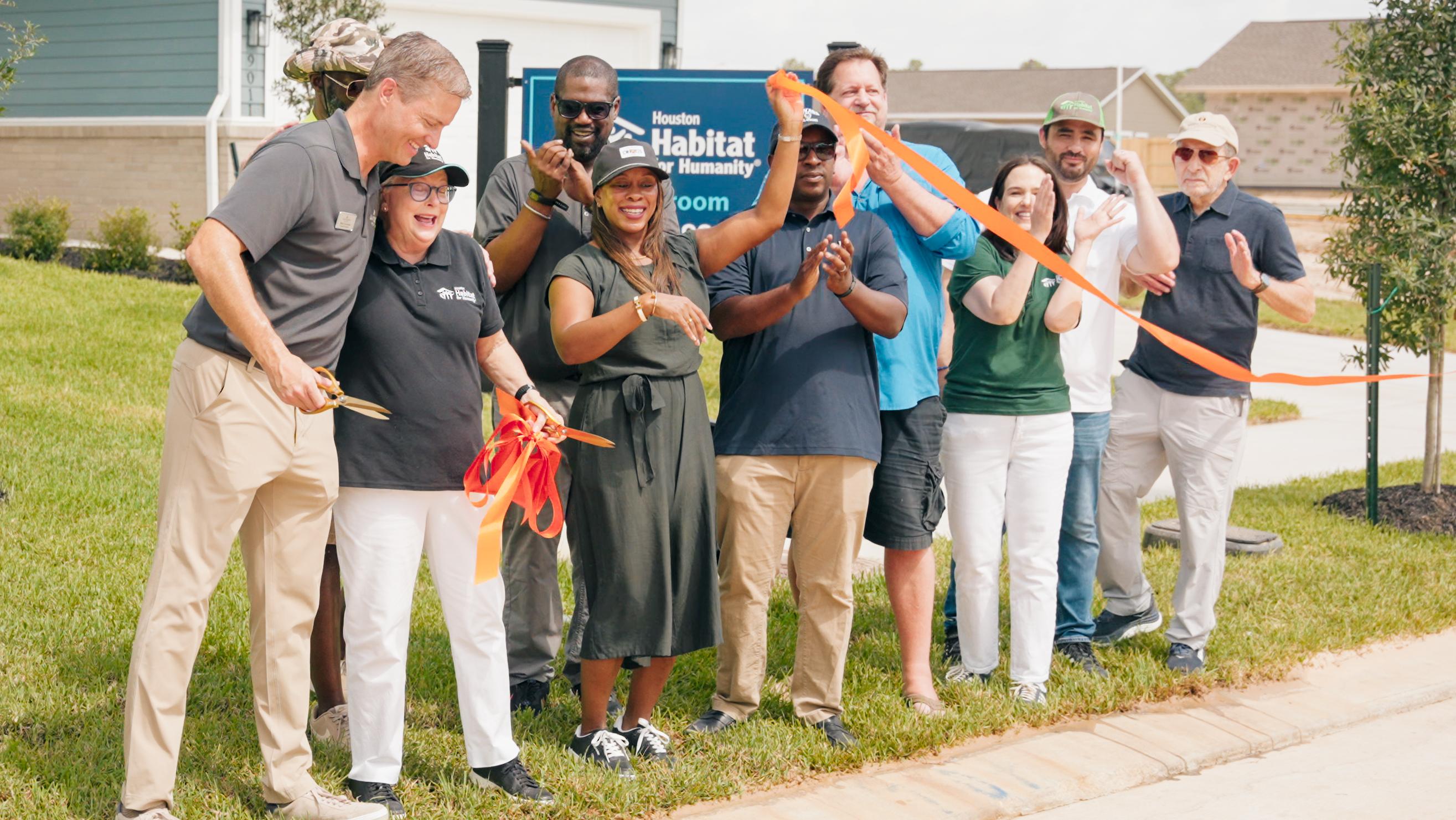 Davidson Homes and Houston Habitat for Humanity celebrate the grand opening and ribbon cutting for Section 2 at Robins Landing in Houston, Texas.