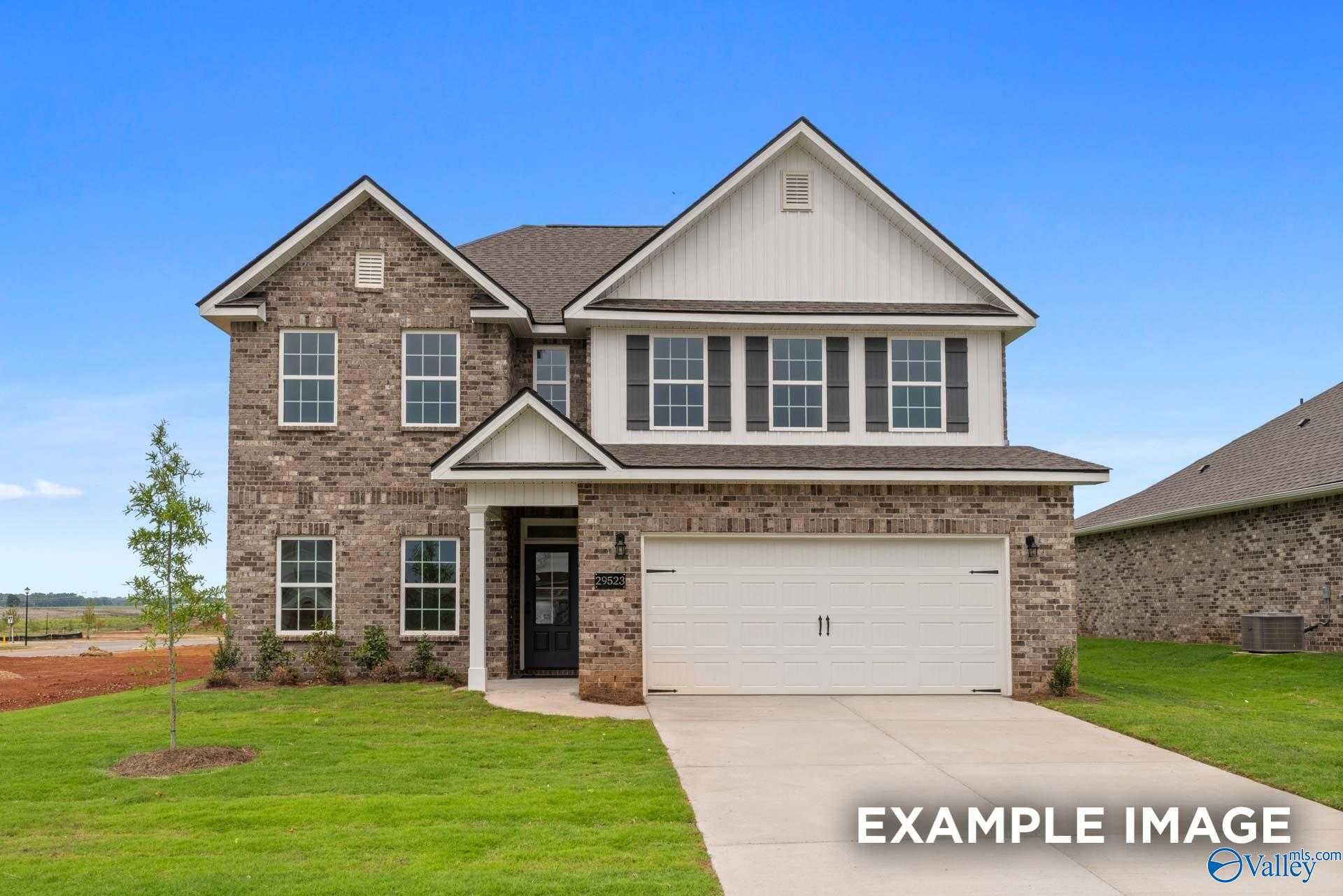 Modern two-story brick home with 2-car garage, front porch, and green lawn in Ricketts Farm, Athens, Alabama - Davidson Homes The Shelby A