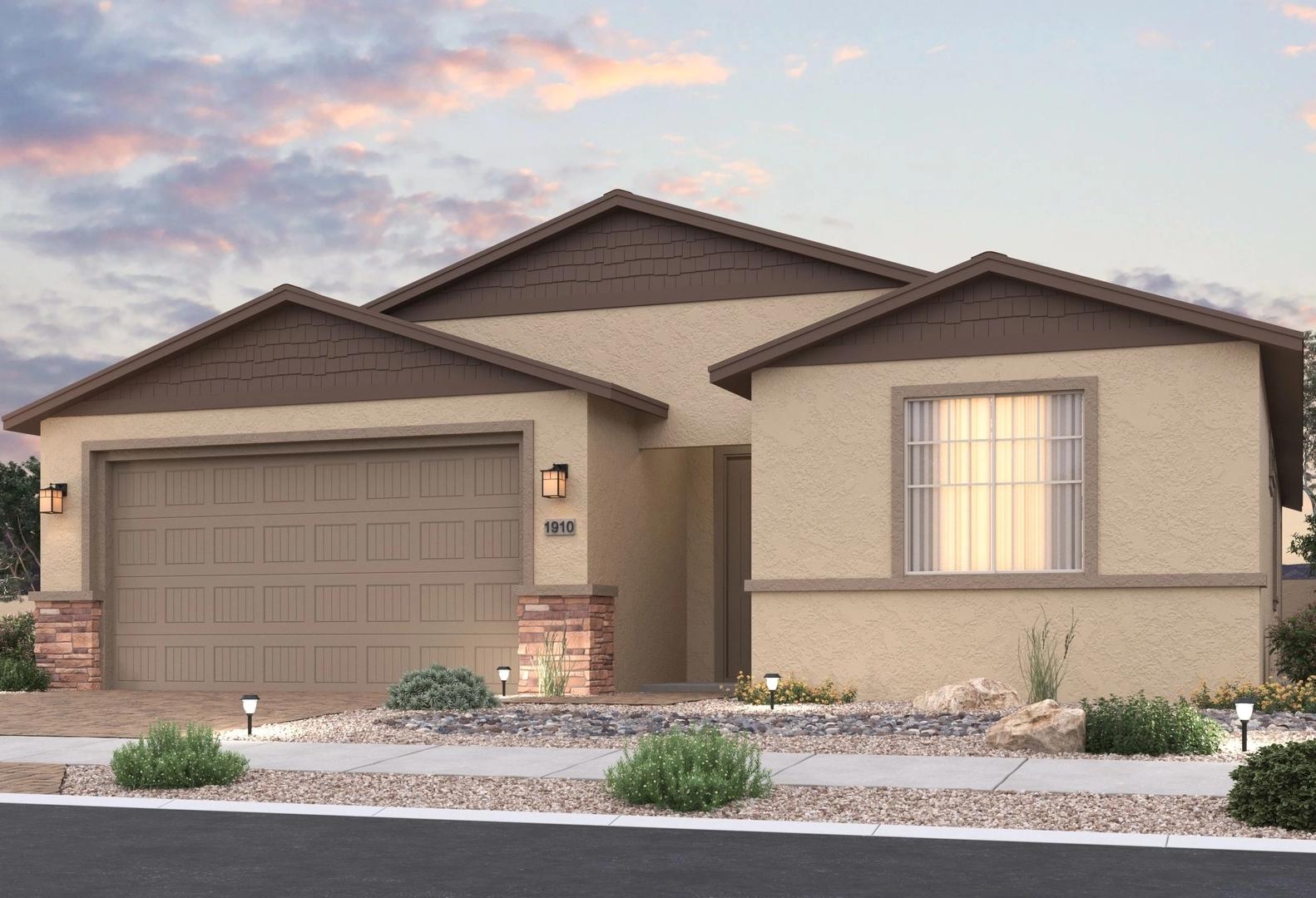 Single-story exterior of The Inspiration home in Prescott Valley, AZ, with beige stucco, brown trim, 2-car garage, and desert landscaping at sunset