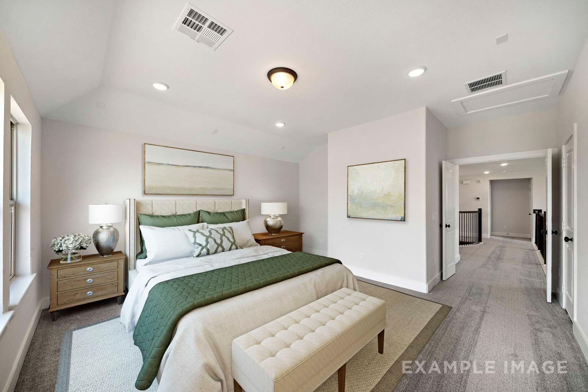 Spacious secondary bedroom in The Victoria with vaulted ceiling, green accents, and hallway leading to upstairs loft area.