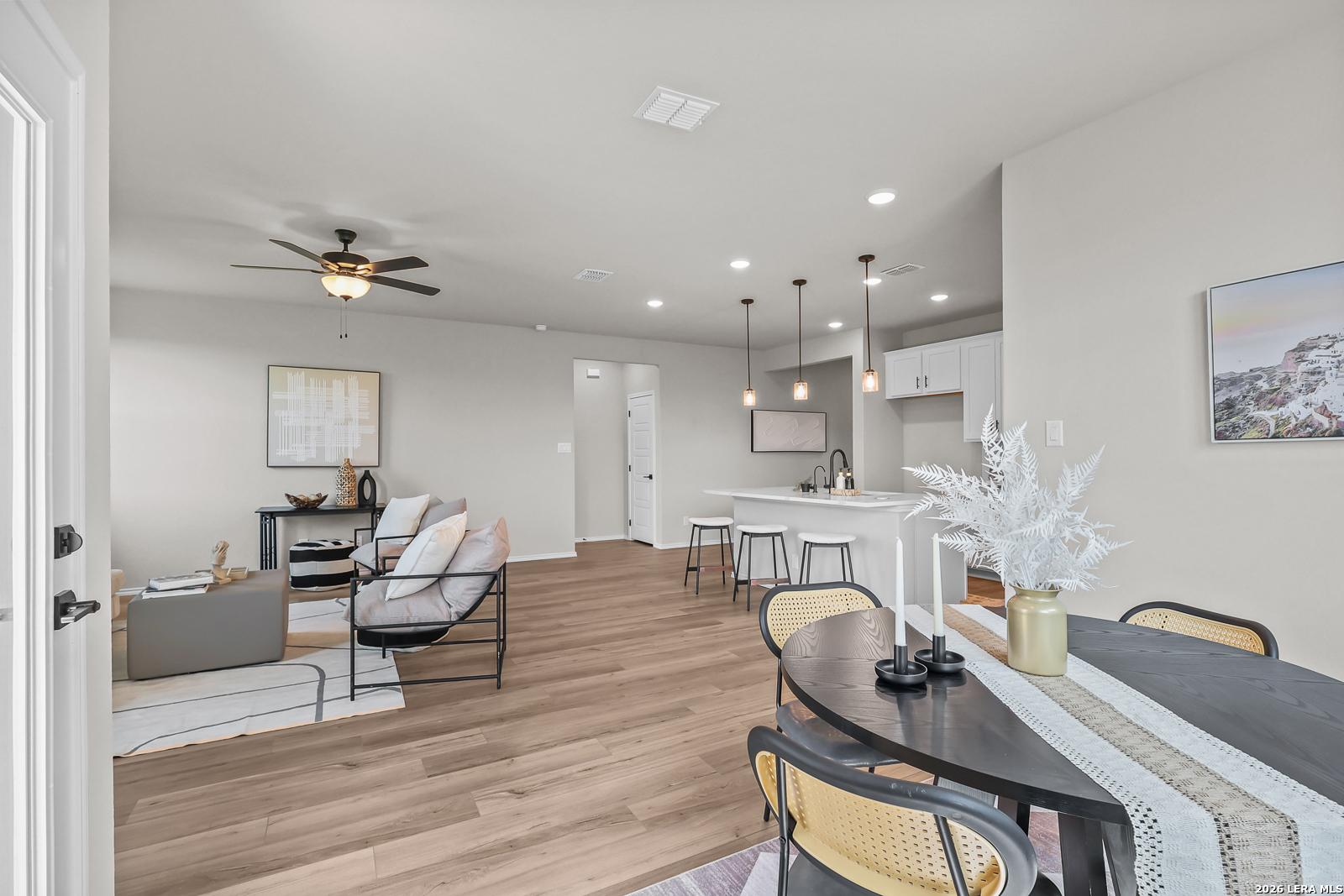 Open-concept living room and kitchen in The Daphne H floor plan at Hannah Heights, Seguin, Texas.