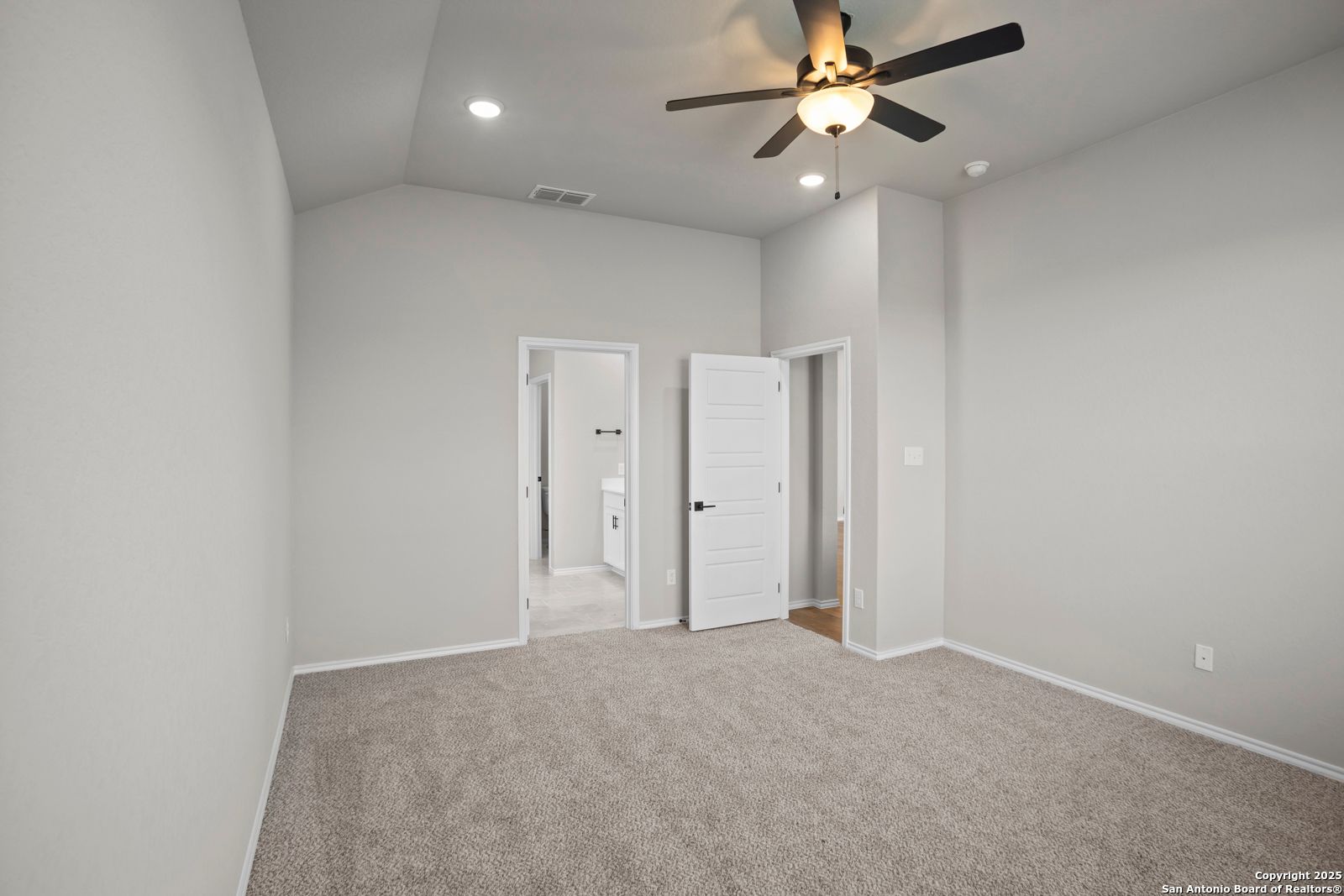 Spacious secondary bedroom with en-suite bath access, ceiling fan, and neutral walls in Davidson Homes Sequoia A, Converse, Texas