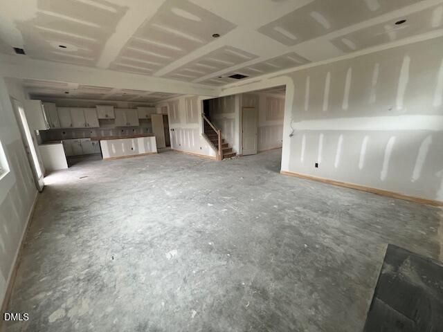 Open-concept floor plan under construction in The Hickory II C by Davidson Homes at Retreat at North Main, Lillington, NC.