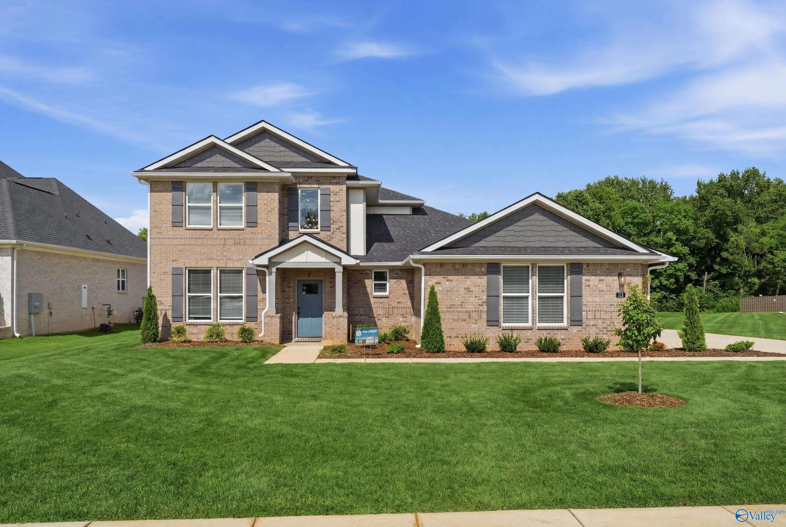 Two-story brick exterior of The Dorado floor plan by Davidson Homes in Riverton Preserve, Huntsville, Alabama.