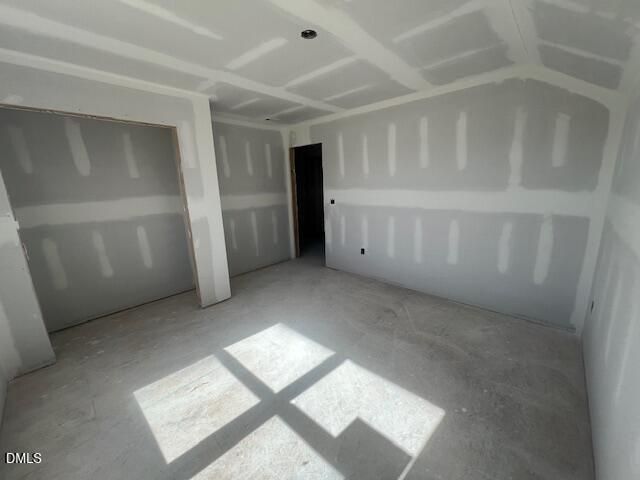 Unfinished bedroom with drywall and tray ceiling in The Ash C floor plan by Davidson Homes, Lillington, North Carolina