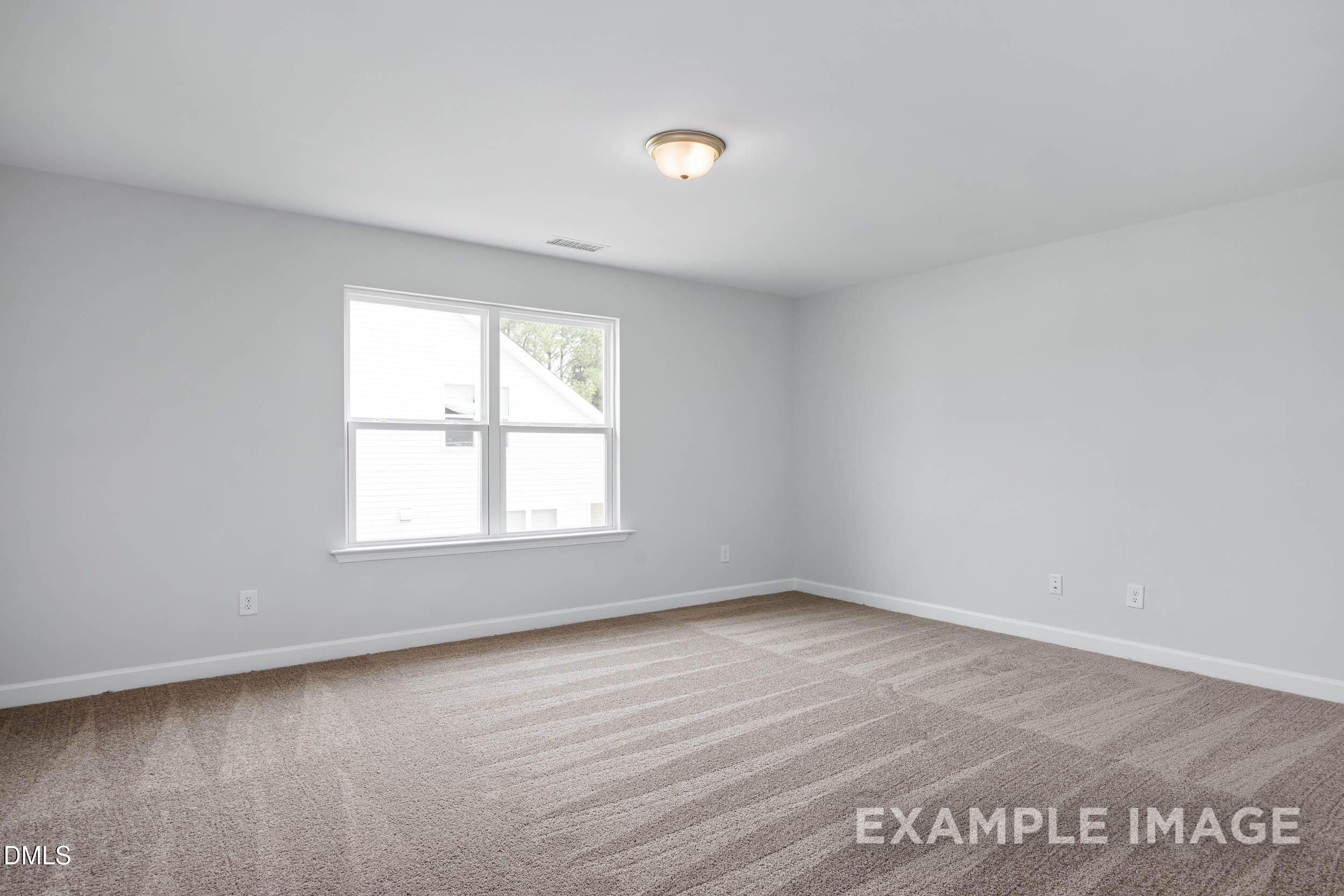 Bright secondary bedroom with gray walls, large window, beige carpet, and ceiling fan light in Davidson Homes The Ash B, Lillington, NC