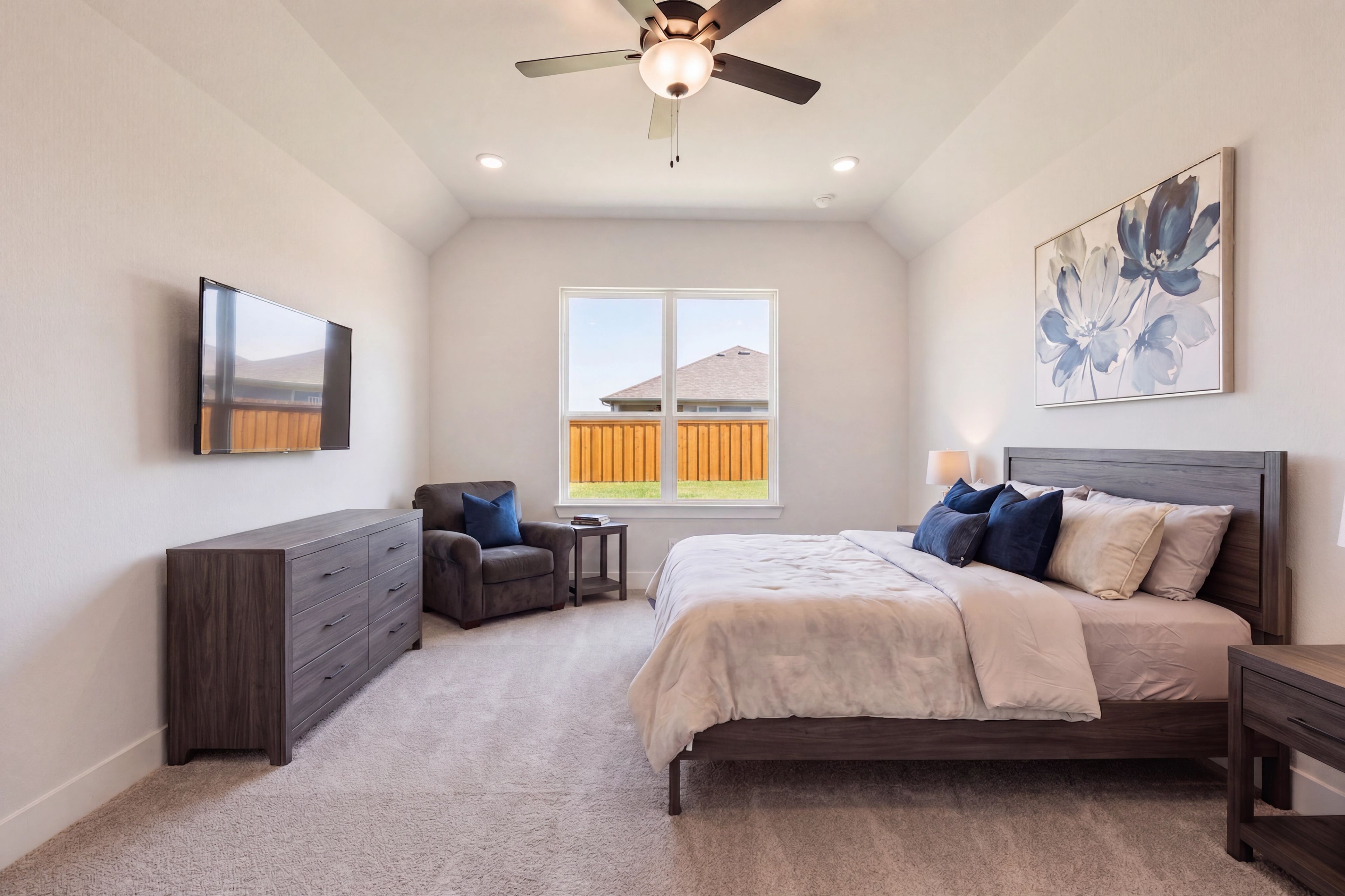 Primary bedroom with tall ceilings at Mercer Meadows in Royse City, TX