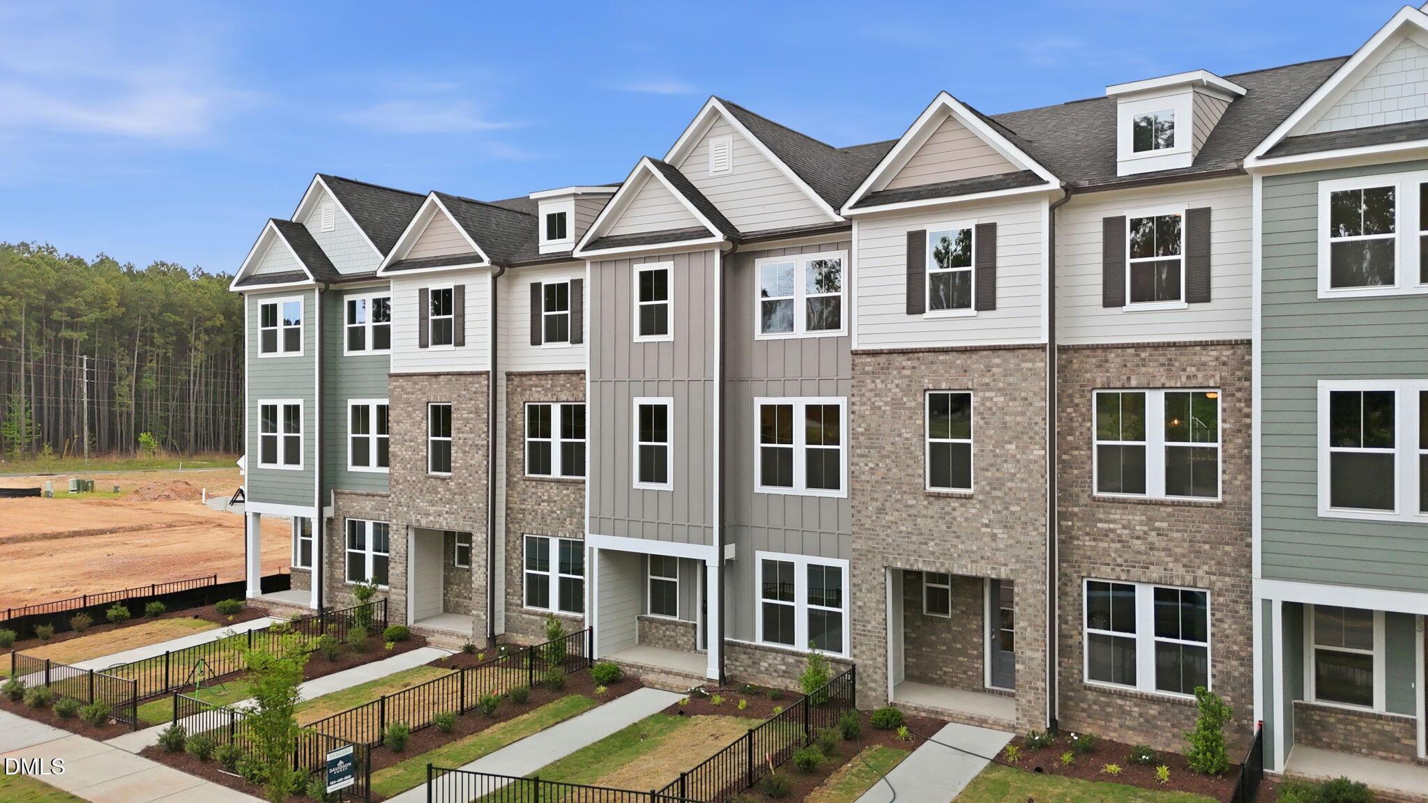 3-story Mitchell Interior floor plan by Davidson Homes in Camden Park, Knightdale, NC with brick and siding exterior.