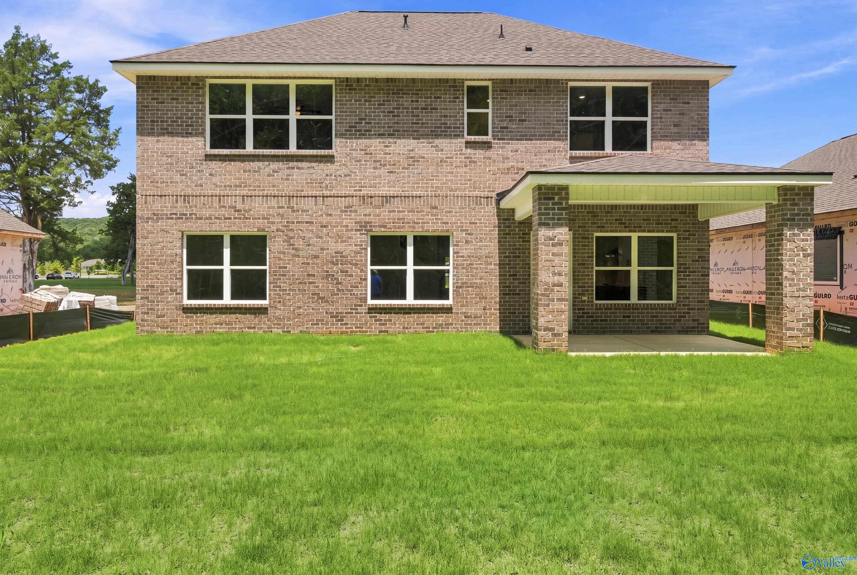 Rear view of The Shelby B floor plan by Davidson Homes featuring a covered patio in Jaguar Hills, Huntsville, Alabama.