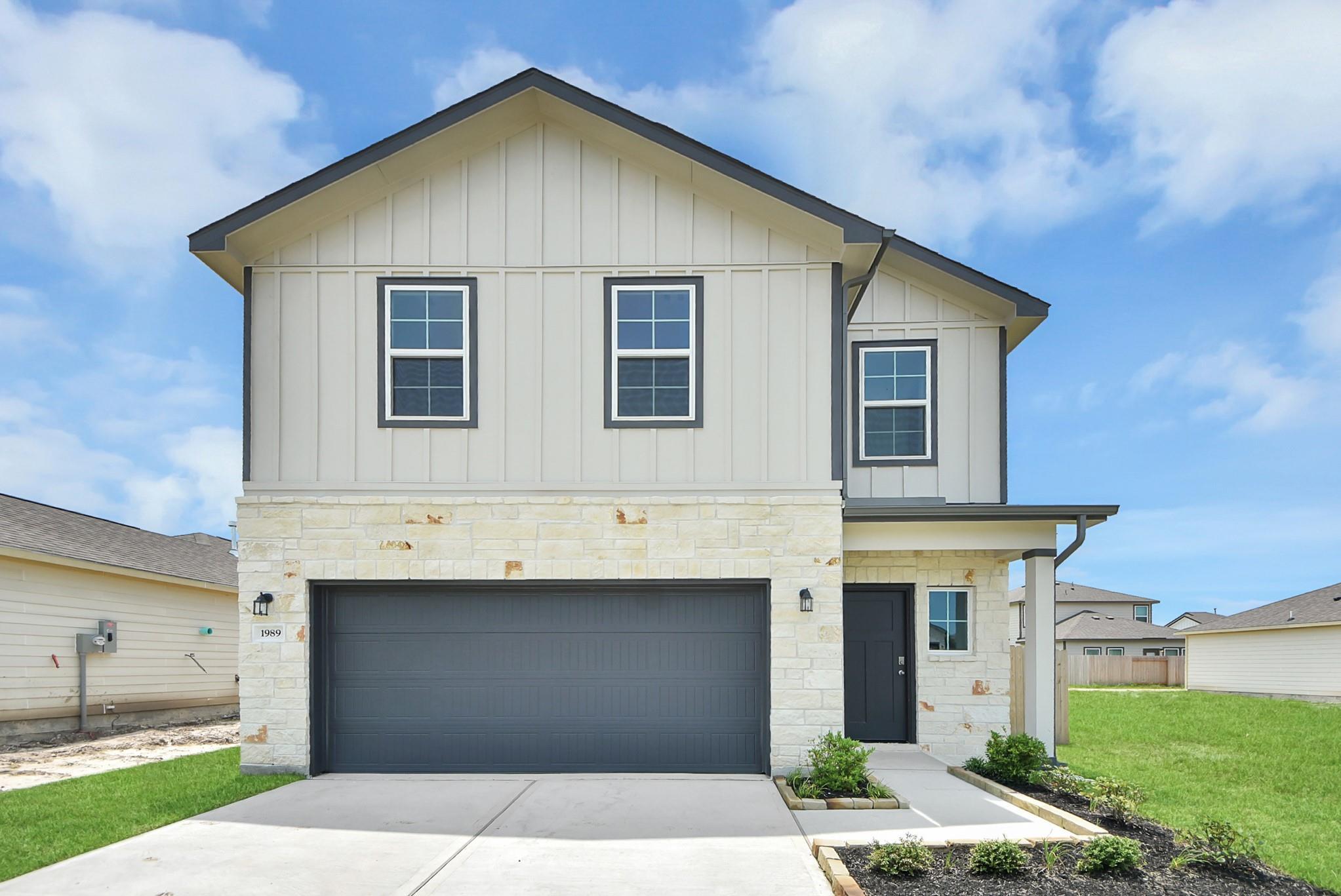 Two-story Blanco E floor plan by Davidson Homes with a 2-car garage in The Villages at WestPointe, Dayton, Texas.