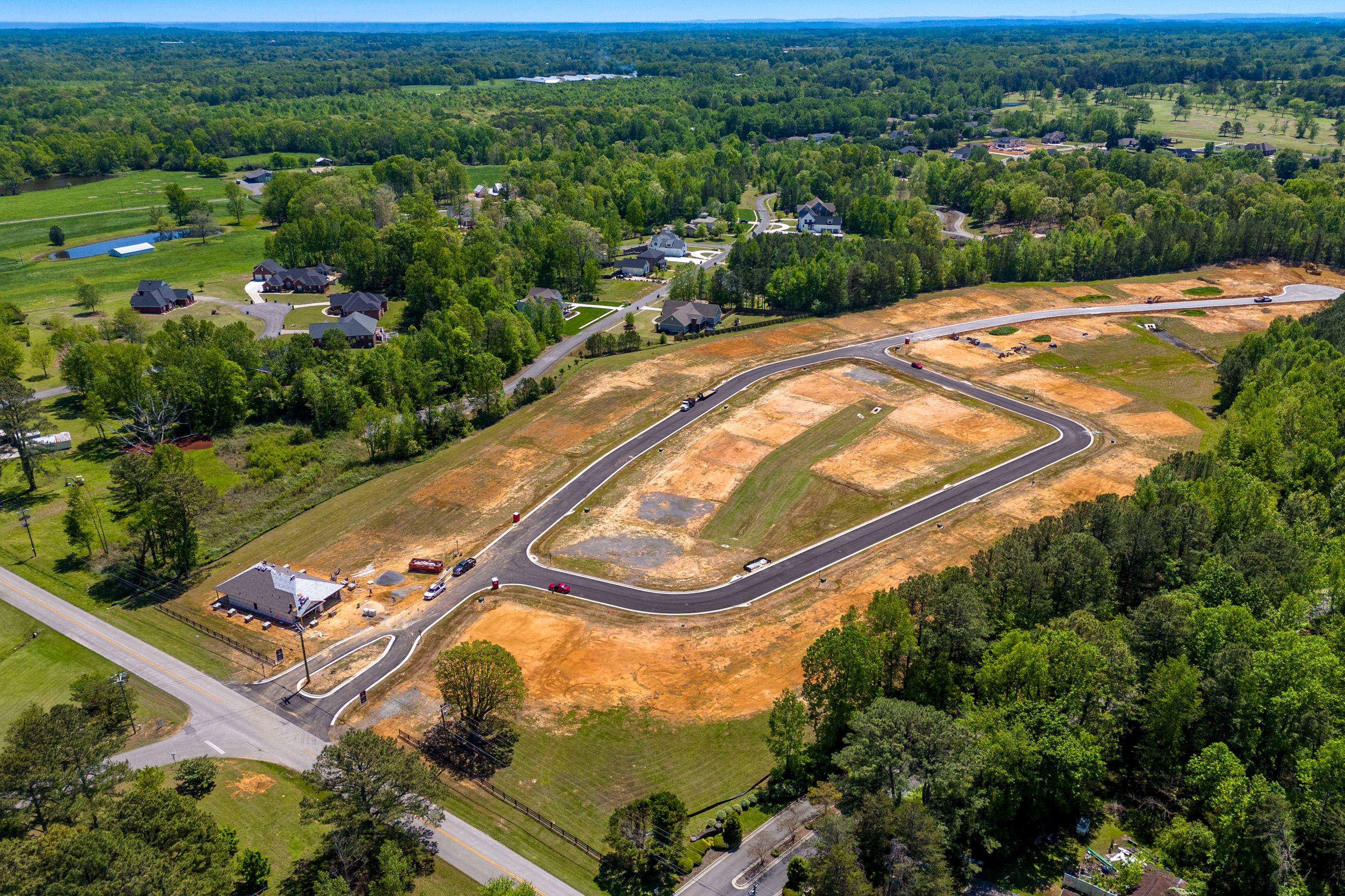 Aerial view of The Highlands in Arab Alabama showing new Davidson Homes construction sites and wooded surroundings