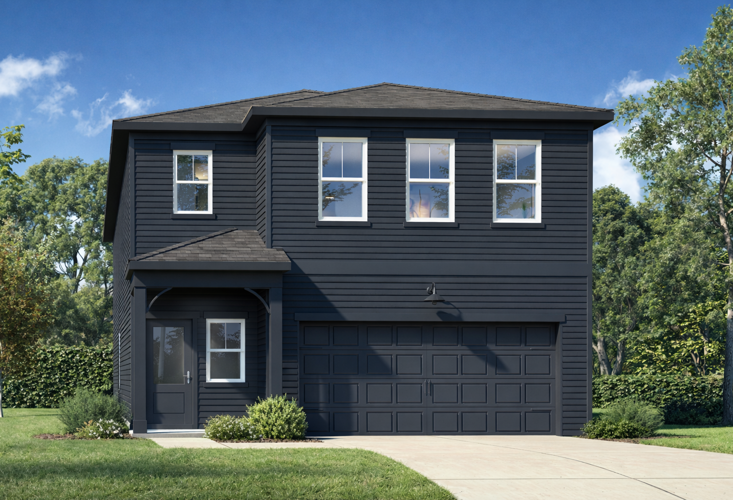 Modern two-story Sinclair A home elevation with dark siding, covered porch, two-car garage, and lush landscaping in Winder, GA