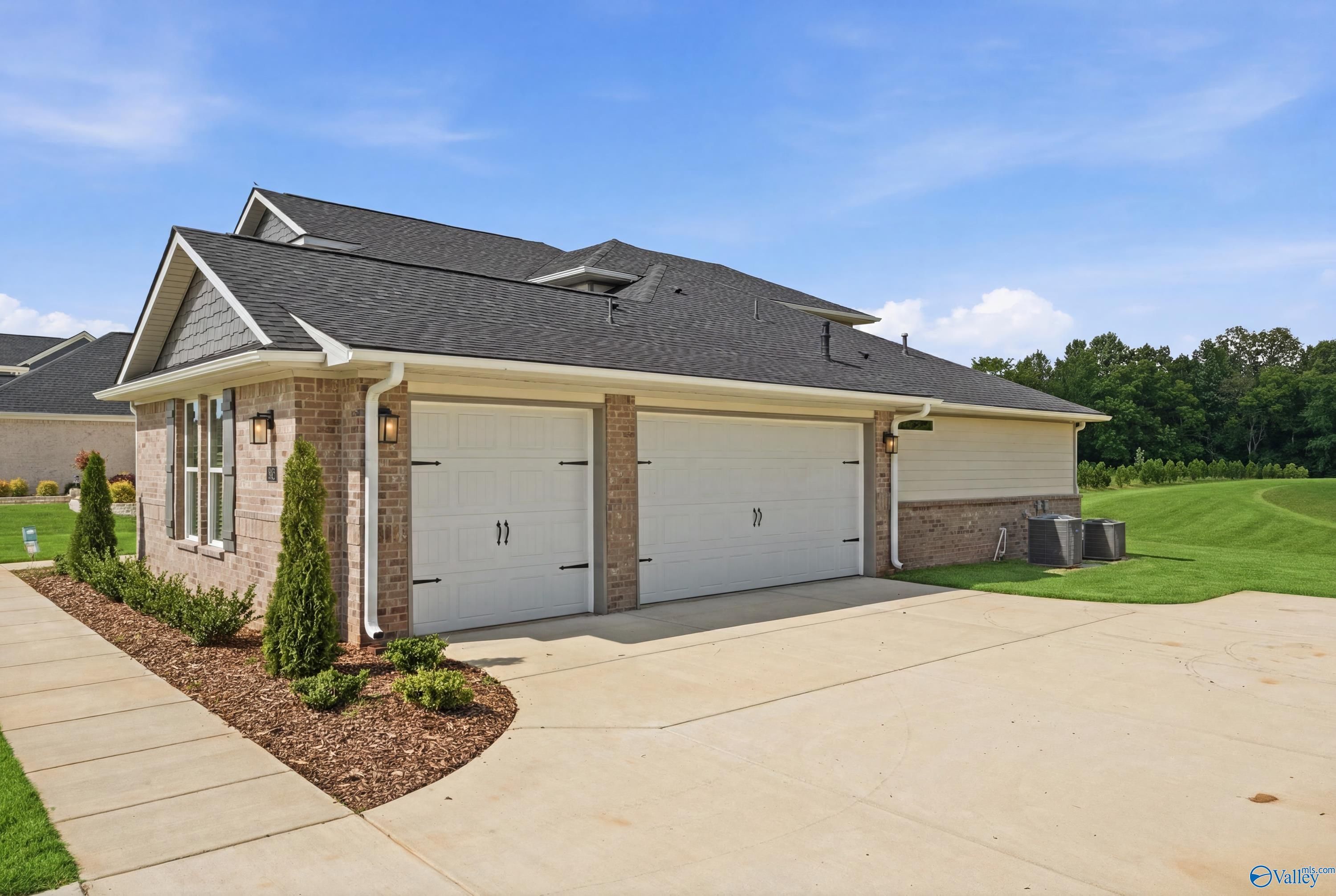 Exterior of 3-car garage on The Dorado floor plan by Davidson Homes in Riverton Preserve, Huntsville, Alabama.