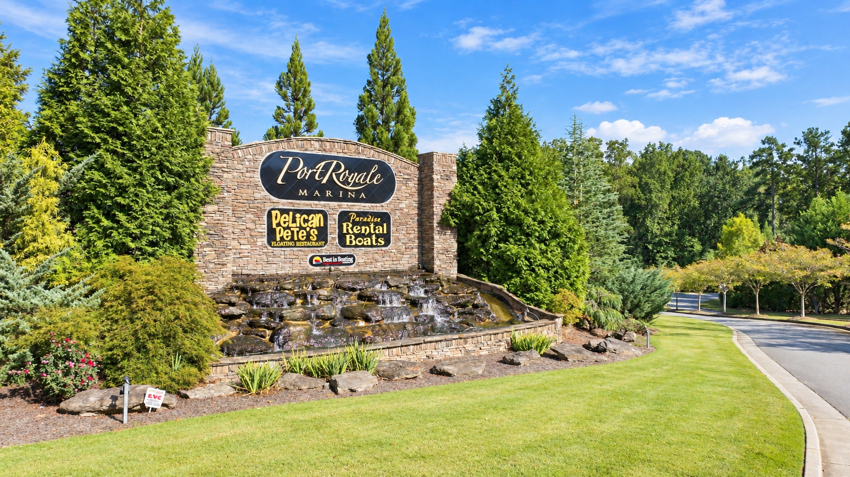 Port Royale Marina stone entrance sign with waterfall near Lake Hollow community in Gainesville, Georgia by Davidson Homes