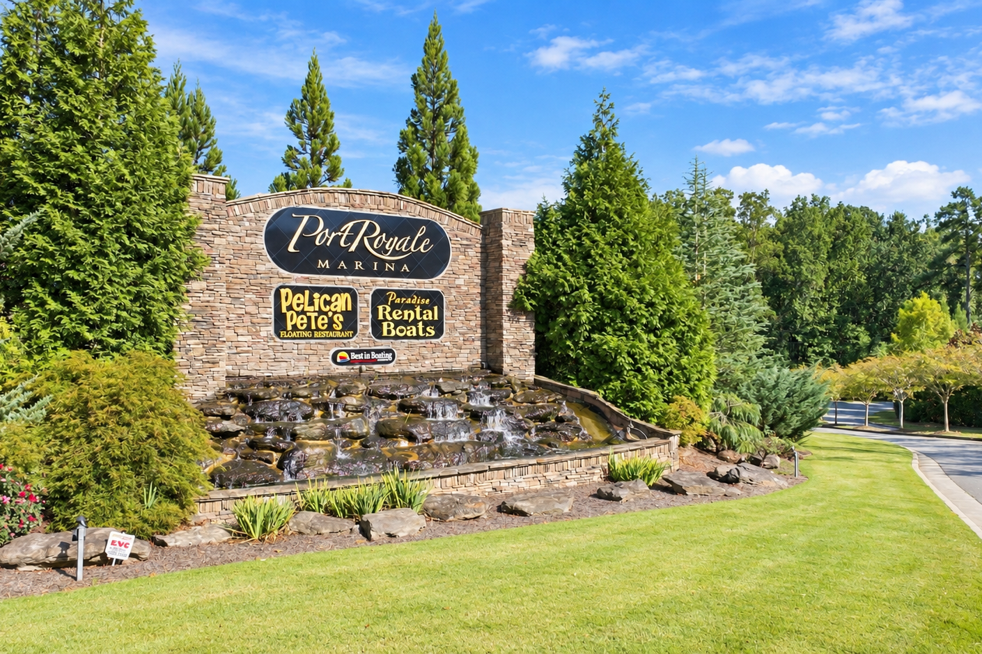Port Royale Marina stone entrance sign with waterfall near Lake Hollow community in Gainesville, Georgia by Davidson Homes