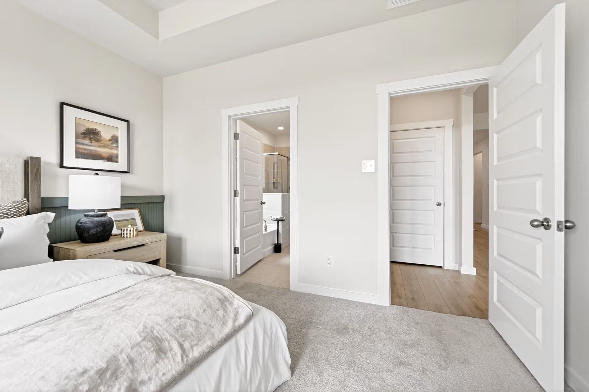 Primary bedroom with en-suite bathroom in The Laurel I floor plan by Davidson Homes in Heartland, Texas.