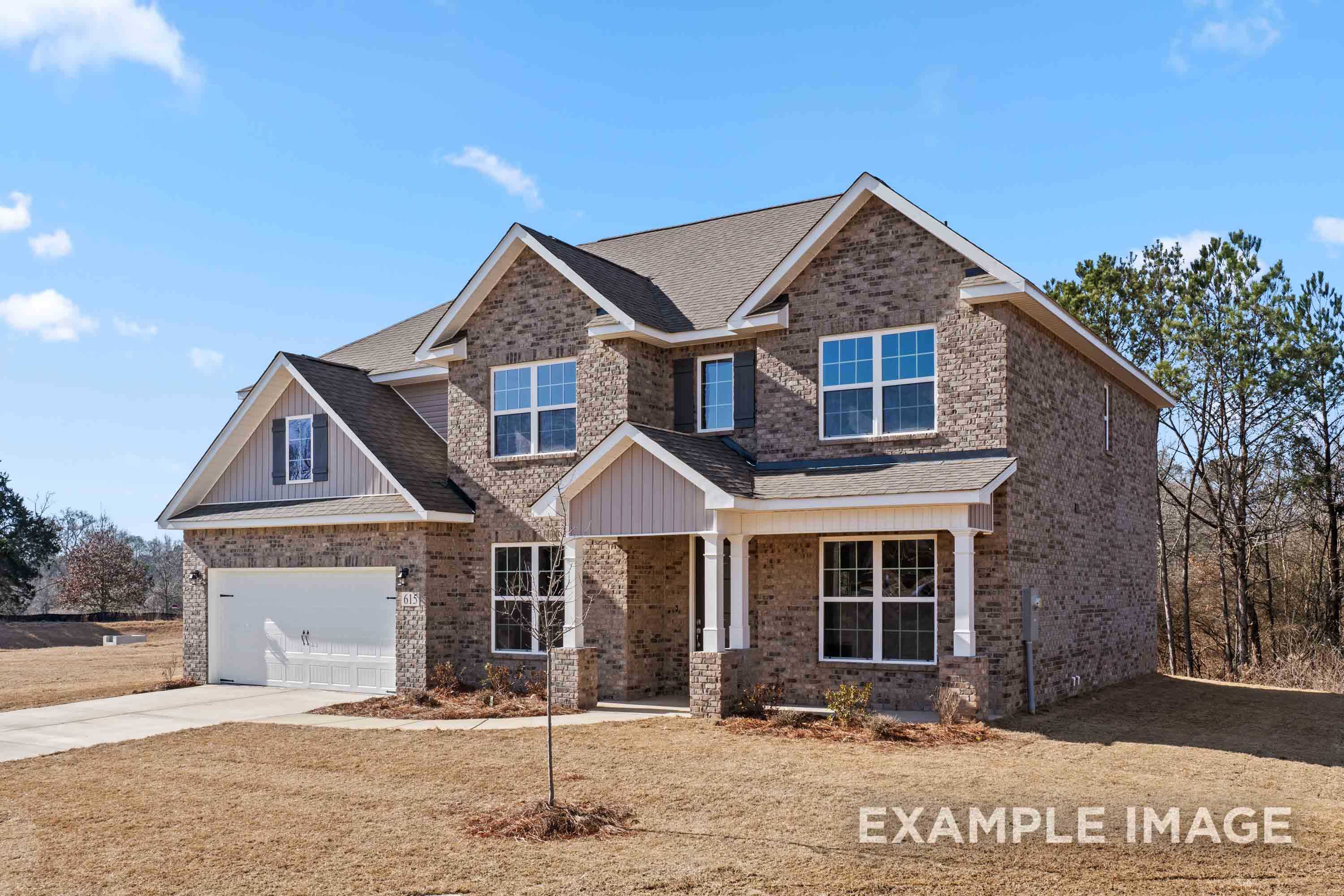 Two-story brick home The Madison B by Davidson Homes, 2-car garage, gabled roof, front porch in Meridianville AL