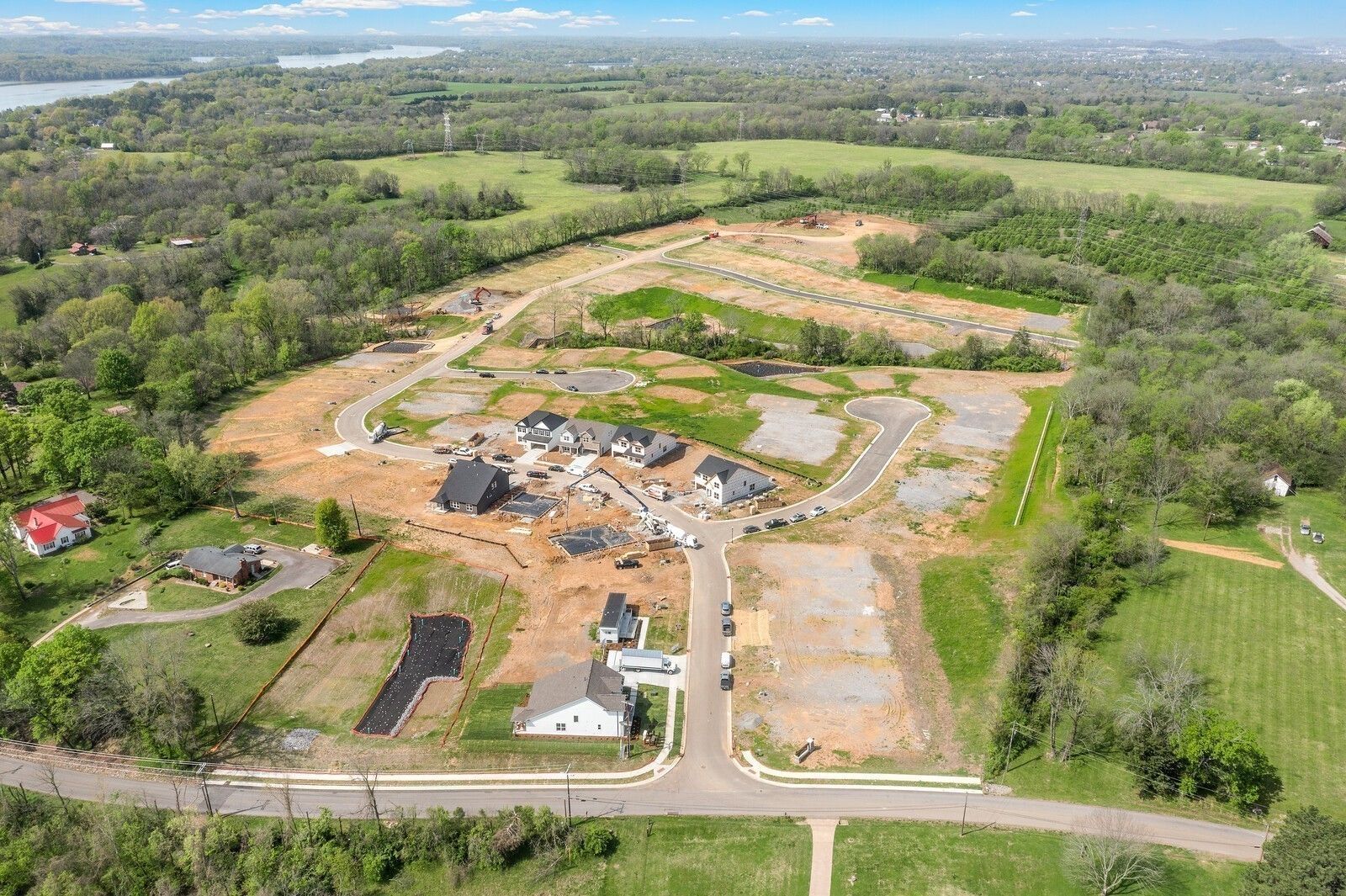 Aerial view of Ridgeport C homes under construction in wooded Woods Crossing, Gallatin, TN by Davidson Homes